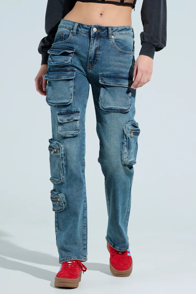 ALL OVER POCKET DETAIL RELAXED FIT JEANS IN MEDIUM BLUE DENIM | AKIRA