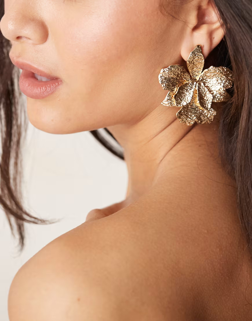 ASOS DESIGN stud earrings with hammered floral detail in gold tone | ASOS (Global)