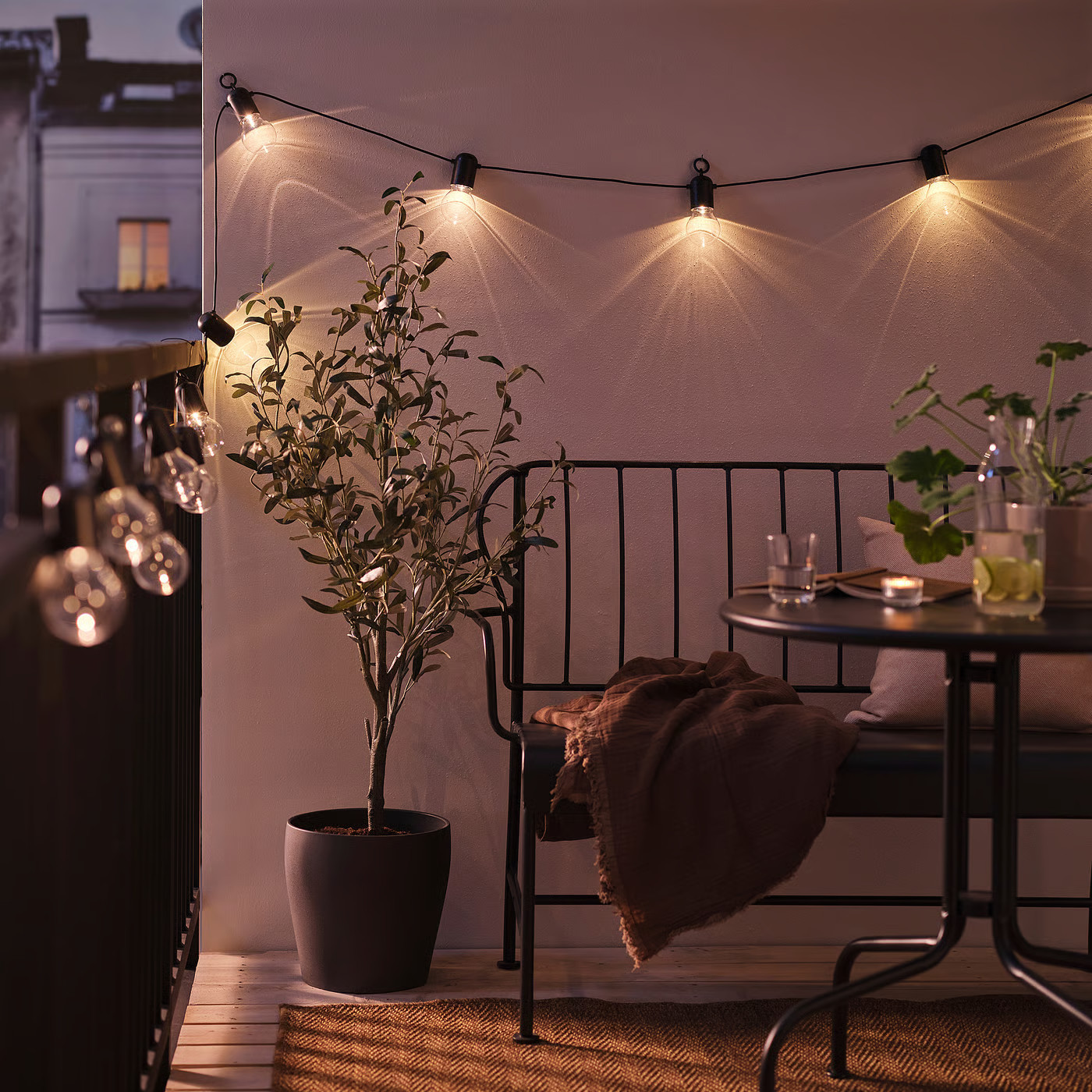 IKEA SVARTRÅ LED string light with 12 lights, outdoor black, Length to 1st light: 15 ' 1 | IKEA US