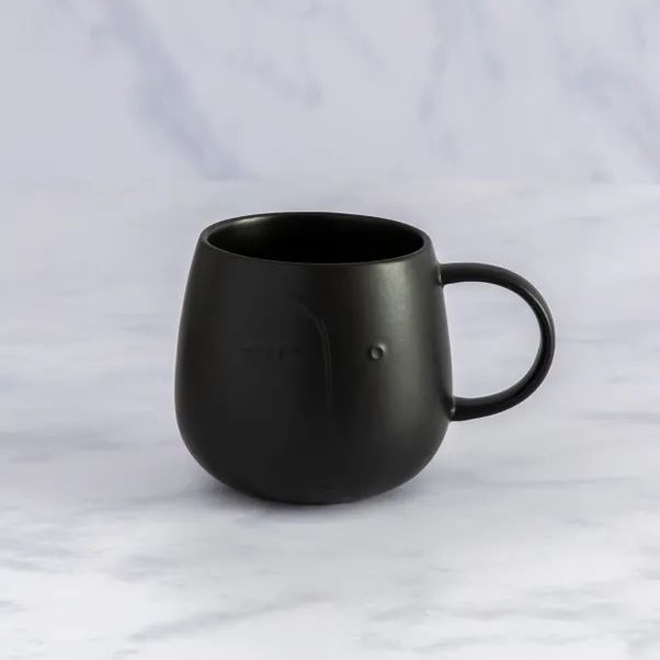 Black Embossed Face Mug | Dunelm