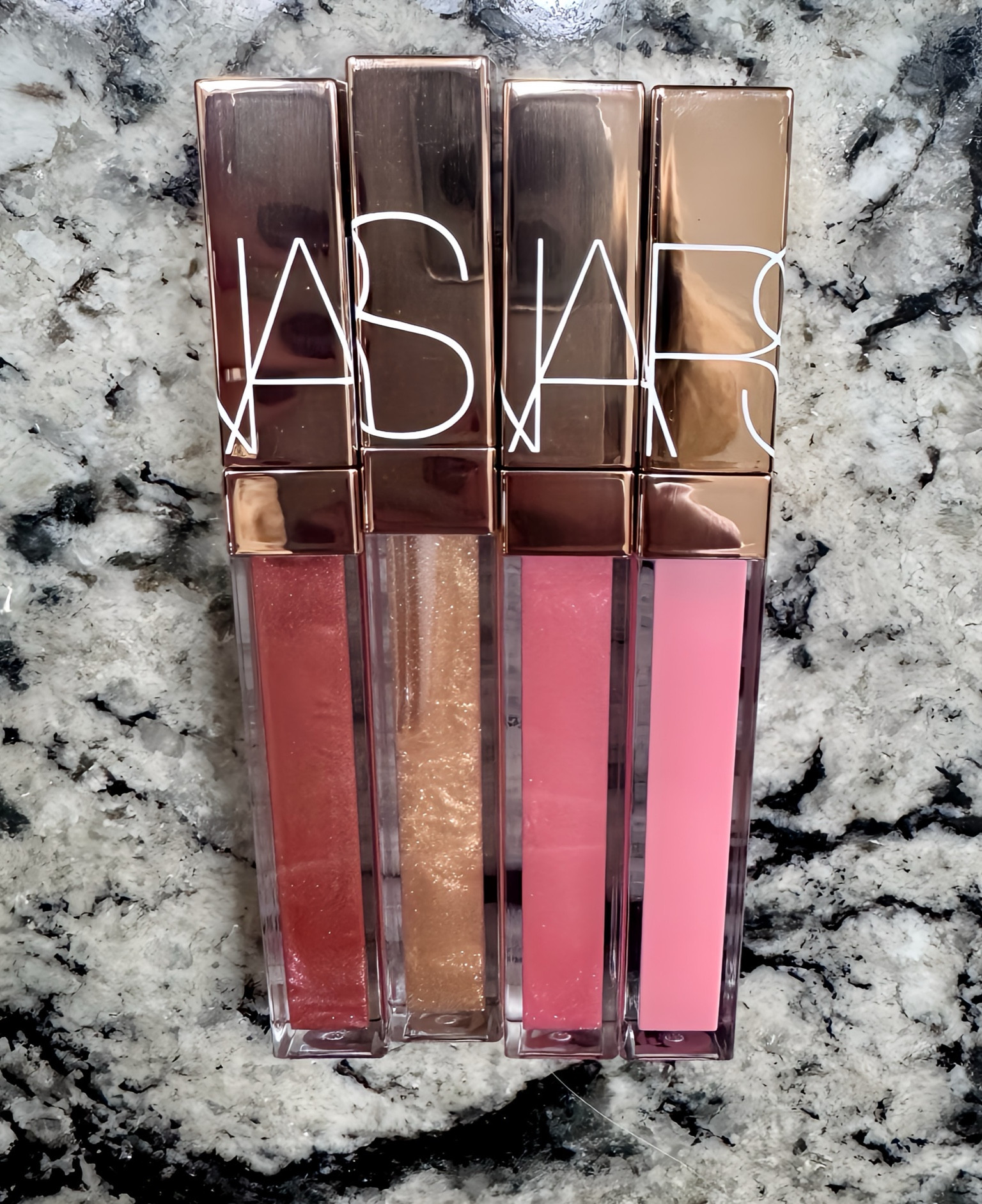 When you find a lipgloss you love, you buy it in 4 colors!  

As someone who is constantly putting on lipgloss (or Aquaphor when I don’t have on makeup), I’m very picky. It has to have the right consistency, stay on, and easily come off of the applicator. 

I bought the gold one and fell in love as soon as I put it on. I went back the next day & bought 3 more colors 🤪

This stuff is amazing!! It’s more like a lip oil, but not greasy at all. It’s so smooth and hydrating, has great shine, and the colors are 💯. I highly recommend !

I also love the NARS Afterglow lipstick!

#LTKBeauty #LTKFindsUnder50 #LTKOver40