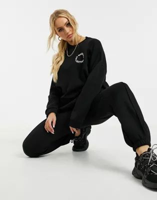 ASOS Weekend Collective tracksuit oversized sweat / jogger with logo in black | ASOS (Global)