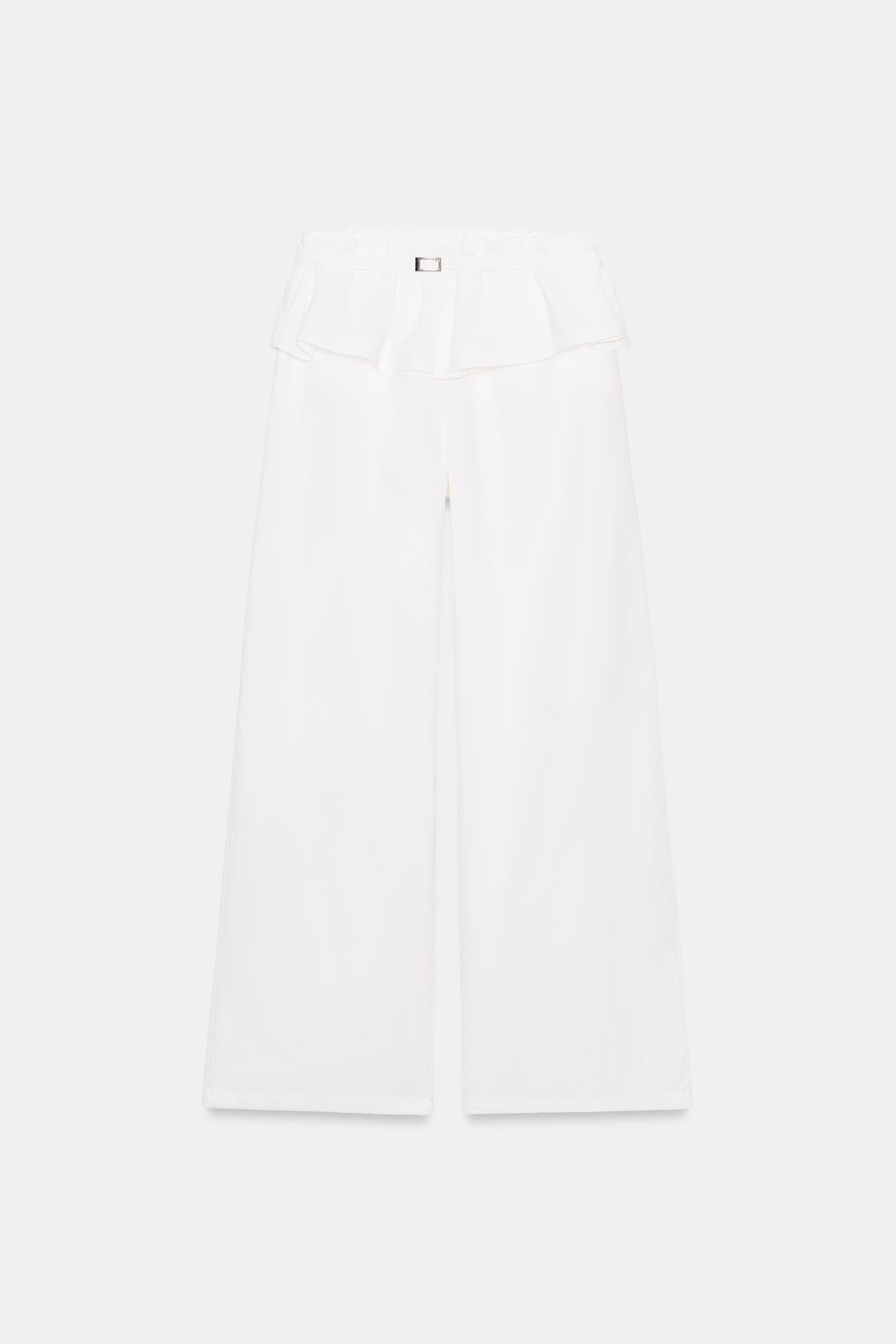 High-waisted elastic pants. Overlapping waistband detail in matching fabric. Thin belt with metal... | Zara US