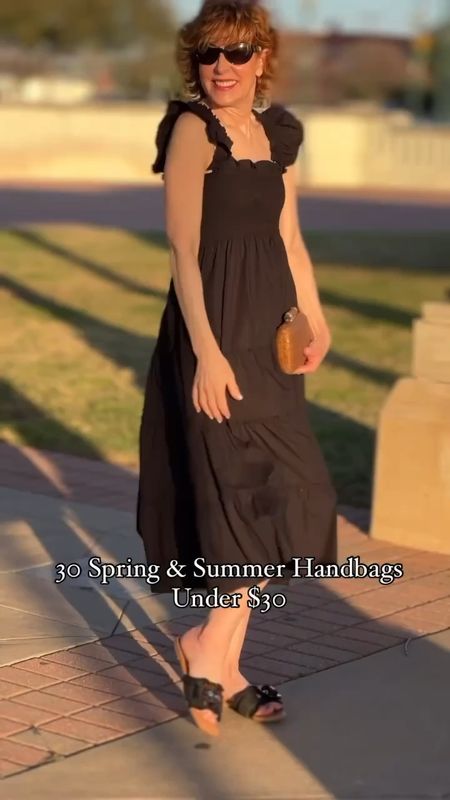 This classic nap dress in black cotton is so chic and SO feminine! I love the smocked bodice, the ruffled sleeves, and the wide ruffle hem. 

I paired it with an affordable pair of scallop-edge raffia buckle slides from Target and a straw clutch that's under $26!

Head to emptynestblessed.com to check out more spring & summer handbags under $30!

Follow my shop @emptynestblessed on the @shop.LTK app to shop this post and get my exclusive app-only 

#LTKitbag #LTKfindsunder50 #LTKshoecrush