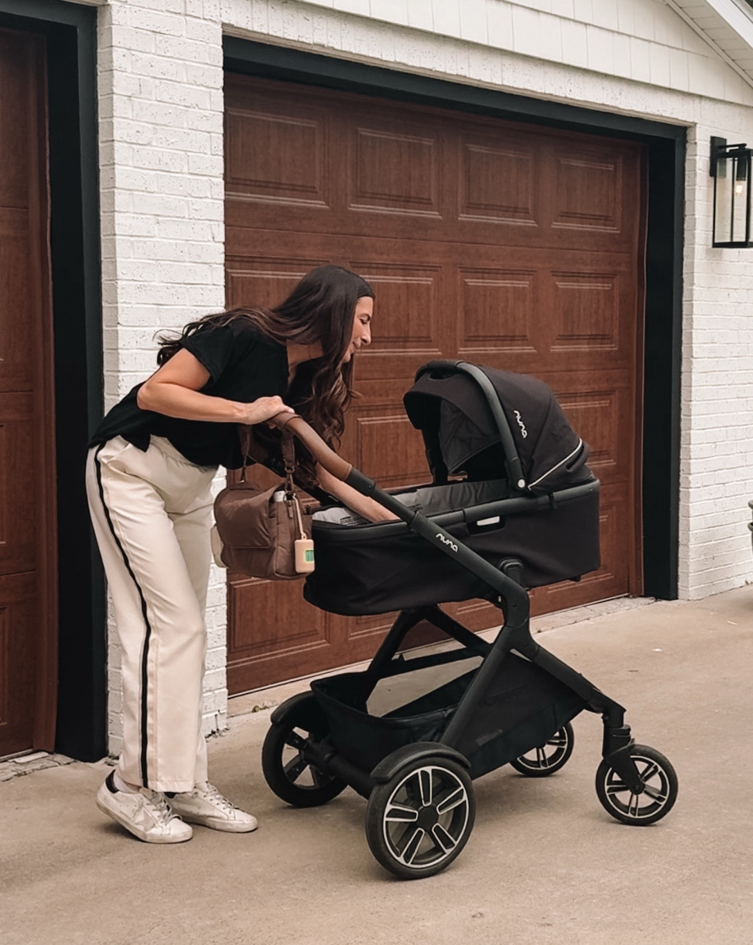 mom bag > overpacked diaper bag

things I love about this diaper caddy from @calpak 

• it fits everything I need for 2 under 2
• converts to a crossbody diaper bag for quick outings
• pacifier holder 🙌🏼 need I say more?
• expandable (I’m generally an over packer 😅)
• 2 insulated drink pouches (I put sunscreen in them for now)
• zipper pouches on front and back 
• multiple compartments on the inside to stay organized 

#LTKmomlife #LTKTravel #LTKBaby