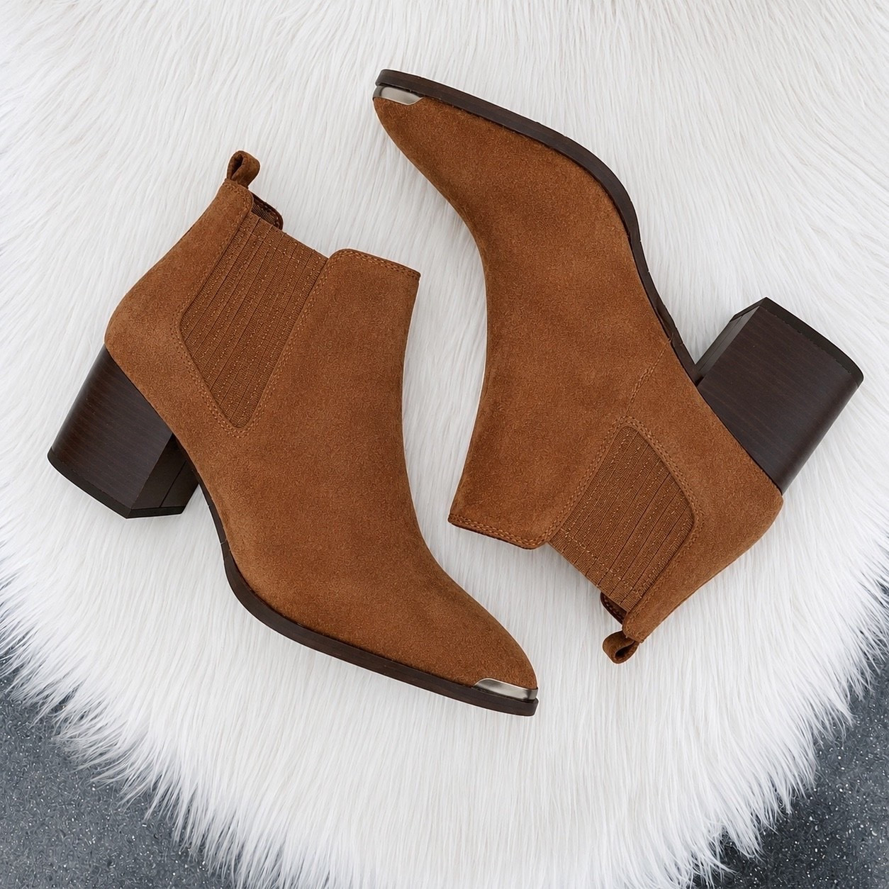 PAIGE Lyra Pointed Toe Chelsea Boot

These are the definition of elevated everyday style. 🤎 The pointed toe and rich suede give them a luxe designer feel, while the sculpted block heel makes them easy to wear from coffee runs to date night. They fit true to size, hug the ankle beautifully, and are surprisingly comfortable thanks to the stable heel. If you’re between sizes or plan to wear thicker socks in the fall, consider going up half a size.