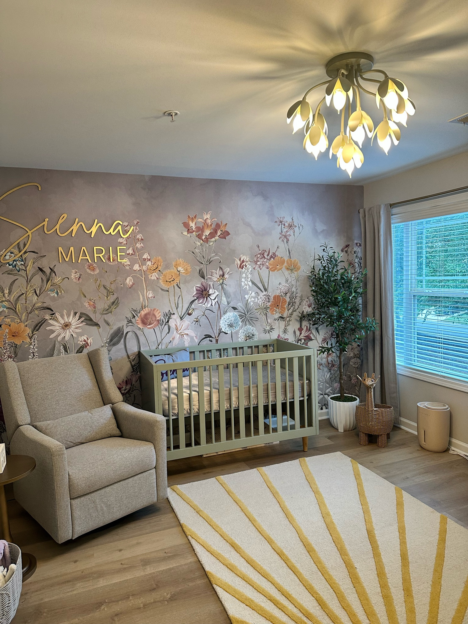  A sweet and classy nursery for our baby girl 💟

ALL OTHER DECOR: 
Wallpaper: Wallism - Summer Meadow 
Exact Giraffe + Elephant: TJ Maxx
Diaper Caddy: TJ Maxx 
Floral Lamp: Marshalls 
Mirror: Home Goods 
Blanket Ladder: Home Goods 
Olive Tree: Home Goods
Side Table: At Home 

#LTKkids #LTKbaby #LTKhome