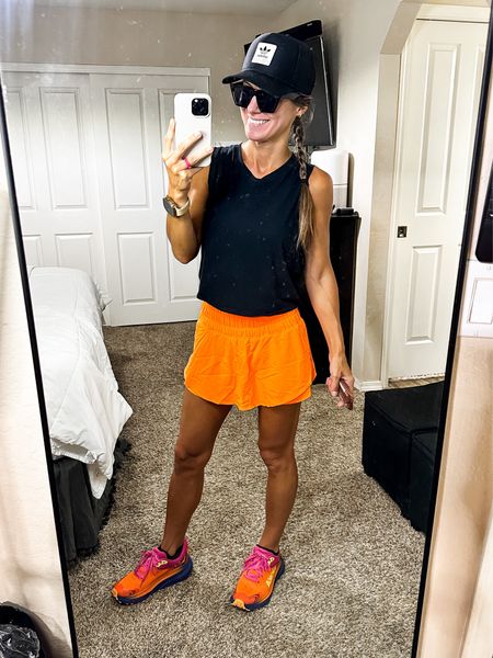 Amazon dupe of free people way home skort in bright orange - I’m in XS tts

Amazon Crz tank in small 

Hoka challenger atr tts 

#LTKunder100 #LTKFitness #LTKFind