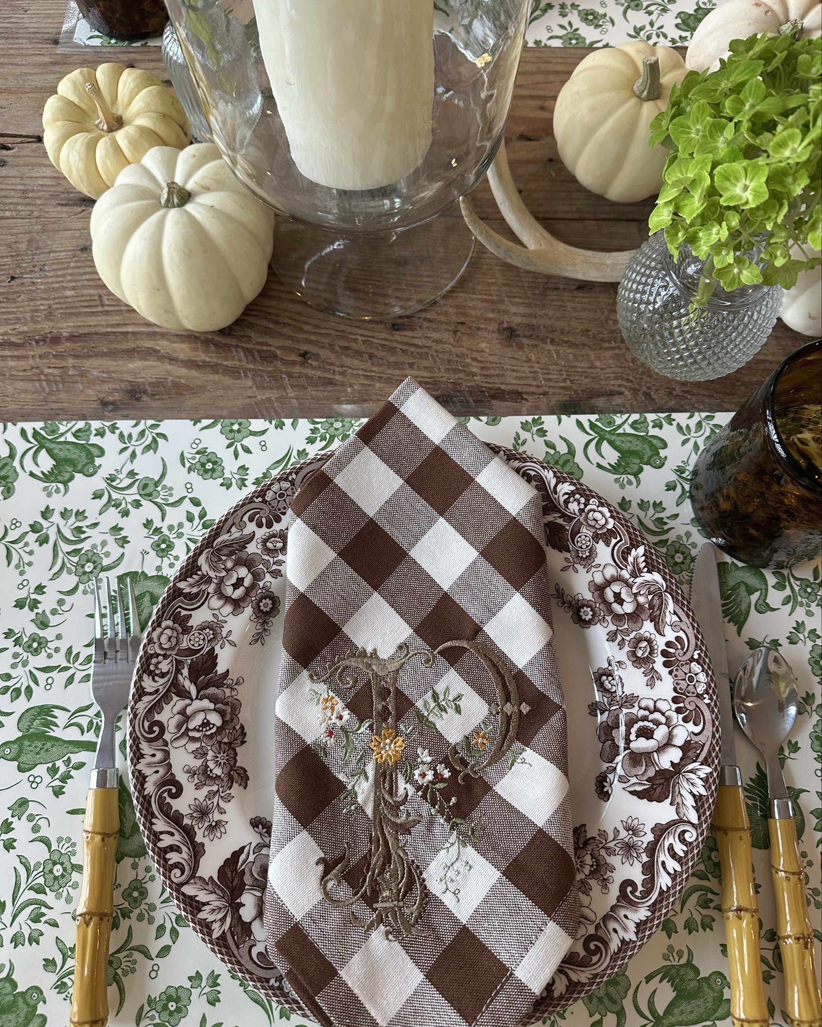 The prettiest green and brown Thanksgiving table. I love these placemats. I got them laminated at Staples so I can use them for years to come. The tiny vases on my table come in a set of 22 and make a great hostess gift.  Spode Delamere is so pretty for fall!

#LTKHoliday #LTKSeasonal #LTKParties