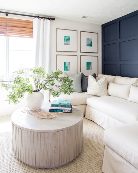 *Coffee table restock alert * Our Omaha updated cozy den with a linen sectional, linen blackout drapes, woven bamboo window coverings, faux greenery, a round wood coffee table styled with coastal decor, an oversized gallery wall, and spring pillows! See more of this space here: https://lifeonvirginiastreet.com/benjamin-moore-hale-navy/.

#ltkhome #ltksalealert #ltkstyletip #ltkseasonal #ltkfamily #ltkfindsunder50

#LTKSeasonal #LTKsalealert #LTKhome