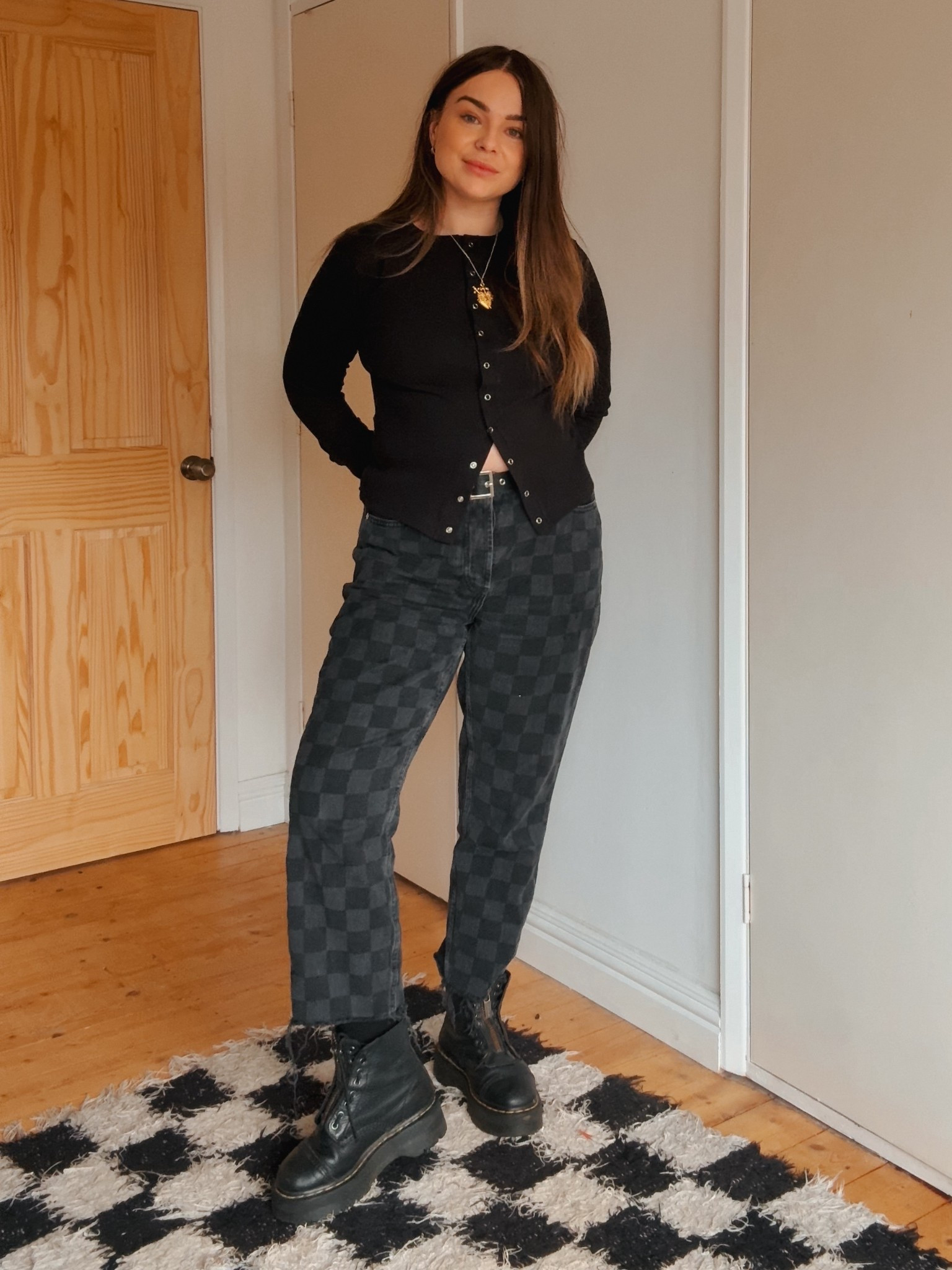 Autumn uniform unlocked 🍂🖤 Black checkerboard jeans, ribbed button-down, and my trusty Dr. Martens Sinclairs — cozy, edgy, and ready for crisp-air days. 

Autumn outfit, autumn outfit uk, checkerboard jeans, checkerboard trousers, black top, black long sleeve, doc martens, docs, dr martens, alt, alternative, alternative fashion 

#LTKeurope #LTKuk #LTKautumn