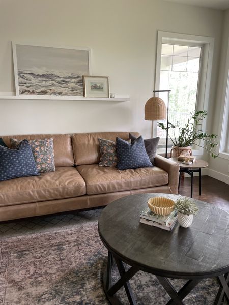 My amazing new brown leather sofa from the Sean & Catherine Lowe Home collection on Wayfair!  Pairs well with my rug, floor lamp, and coffee table.
#leathersofa #livingroom #cozyhomedecor

#LTKhome #LTKsalealert