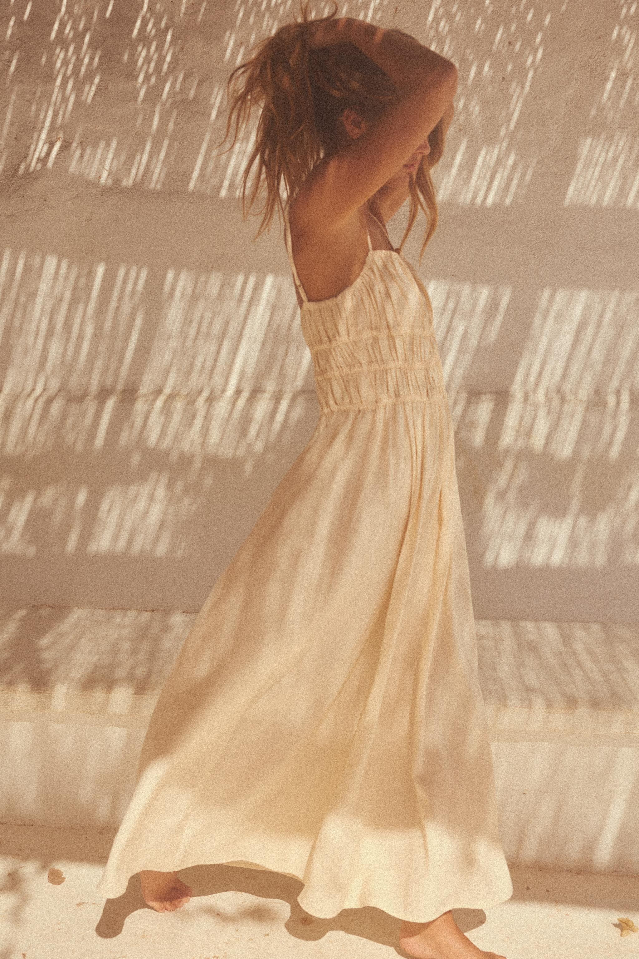 Midi dress made with viscose yarn. Straight elastic neckline and thin adjustable straps. Draped f... | Zara US