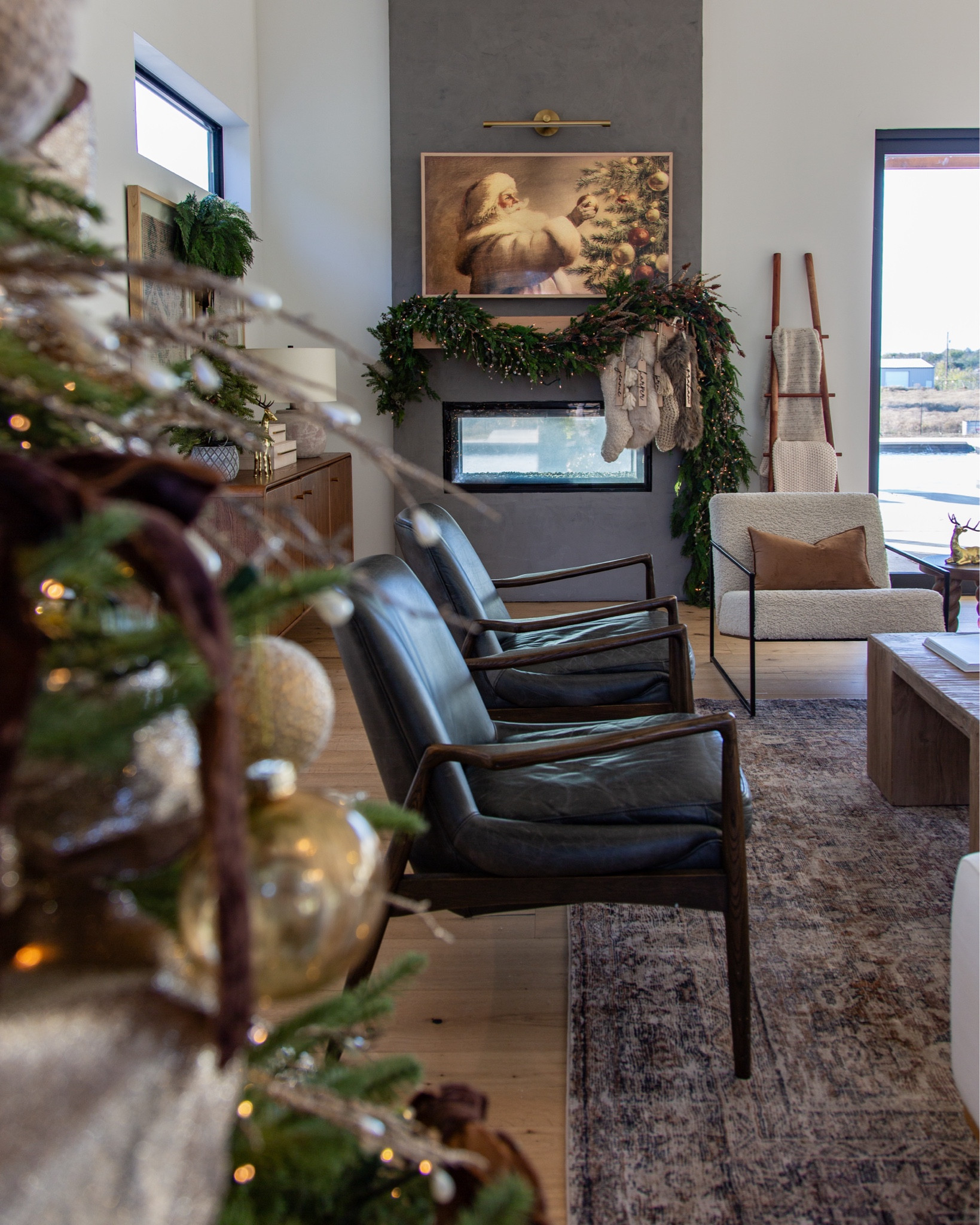 This cozy corner is full of texture + nostalgia. Our Magnolia leather chairs sit perfectly beneath the modern mantel moment, while greenery softens the lines and adds warmth. Our Best Buy Samsung Frame TV steals the show with customizable artwork. The Loloi rug underfoot brings depth and antique character without being overwhelming. This is holiday living — warm, elevated, and lived in.

magnolia leather chair, modern fireplace design, cozy Christmas home, garland mantle decor, loloi rug sale, neutral holiday styling, winter lounge seating 


#LTKCyberWeek #LTKHoliday #LTKHome