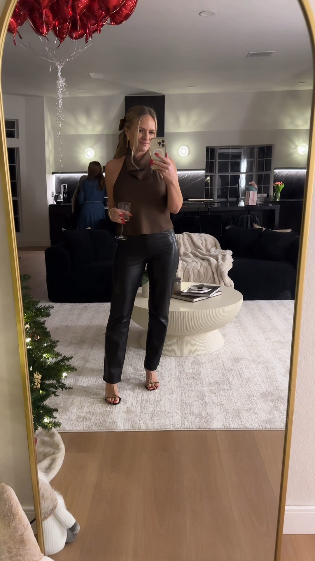 Brown halter top open back
Black leather pants
Hair bow

#LTKootd