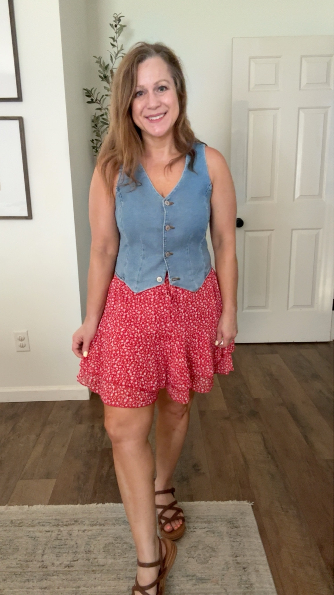 Summer outfit idea 
Perfect for the 4th of July and all summer 
Denim vest 
Red floral skort 
Sandals 

I am in a small in vest and in skort, sandals TTS

#LTKPetite #LTKootd #LTKMidsize