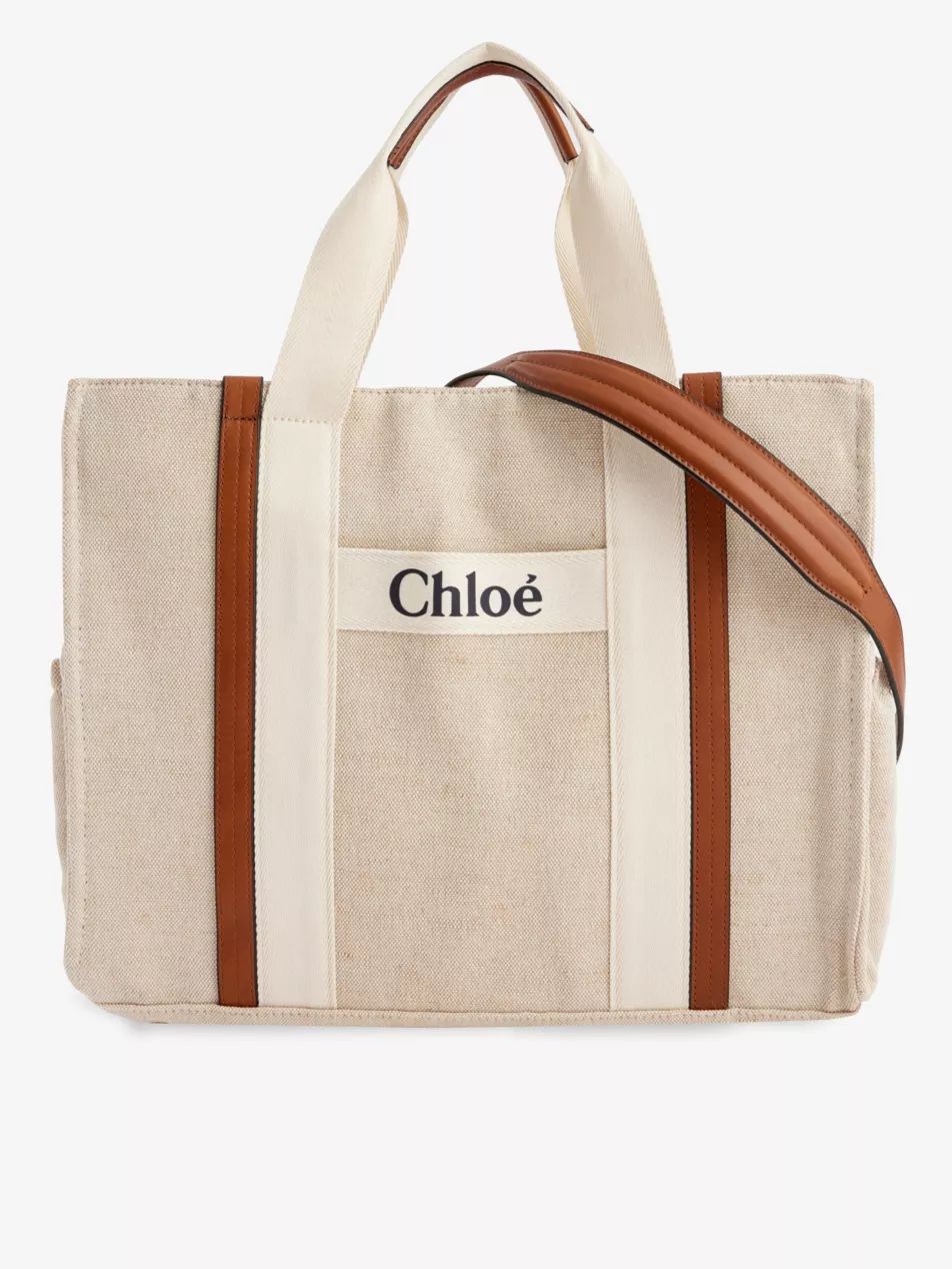 Brand-print jute and cotton-blend baby changing bag | Selfridges