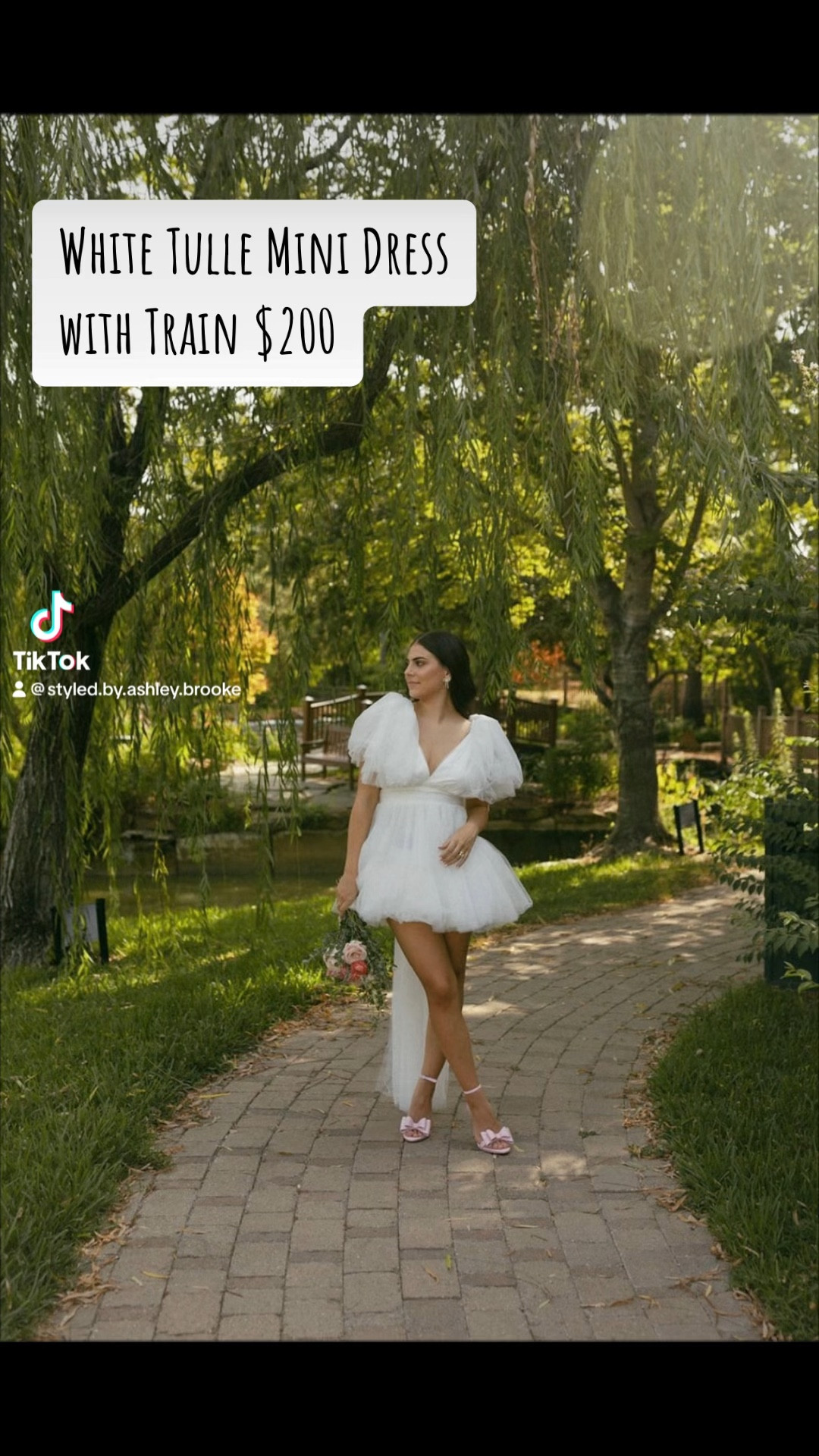 This dress is from my boutique, Styled by Ashley Brooke. 
Link: https://styledbyashleybrooke.com/collections/bridal-collection/products/white-tulle-ribbon-train-mini-dress 

I’ll link similar styles! 

#LTKVideo #LTKwedding
