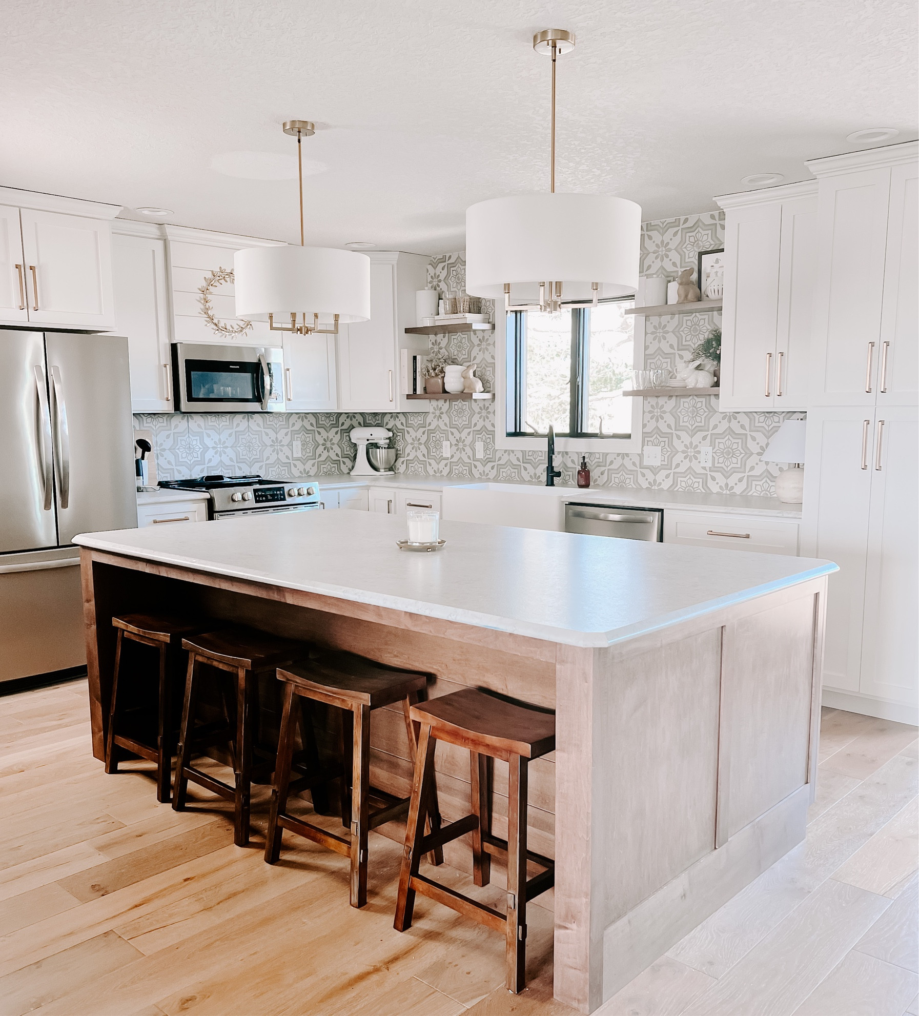Kitchen update
New pendant lights, wood bar stools, and gold cabinet pulls. Kitchen decor kitchen backsplash kitchen tile 

#LTKhome #LTKsalealert #LTKFind
