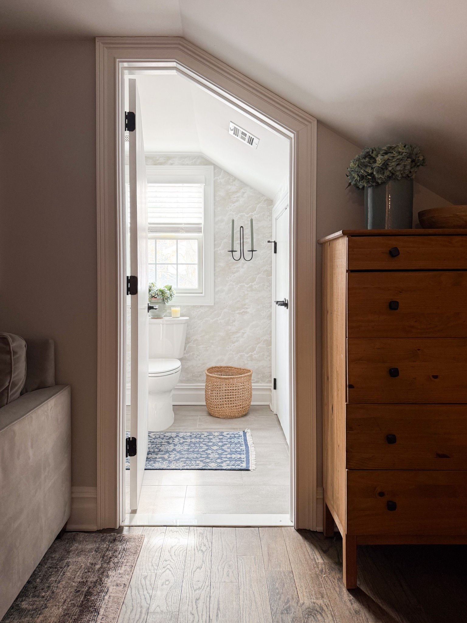 This little bathroom moment feels so thoughtfully layered with soft neutrals and subtle texture. The wallpaper adds just enough movement, while the woven basket and runner bring in warmth that keeps the space feeling cozy and elevated. A perfect example of how small details can completely transform a compact space.

Attic bathroom, attic remodel, small bathroom inspiration, neutral bathroom decor, bathroom wallpaper ideas, cozy bathroom design, woven basket decor, bathroom runner rug, soft neutral interiors, cottage style bathroom, layered home decor, warm minimalist bathroom, powder room ideas girlonthehudson

#LTKdayinmylife #LTKHome #LTKSeasonal