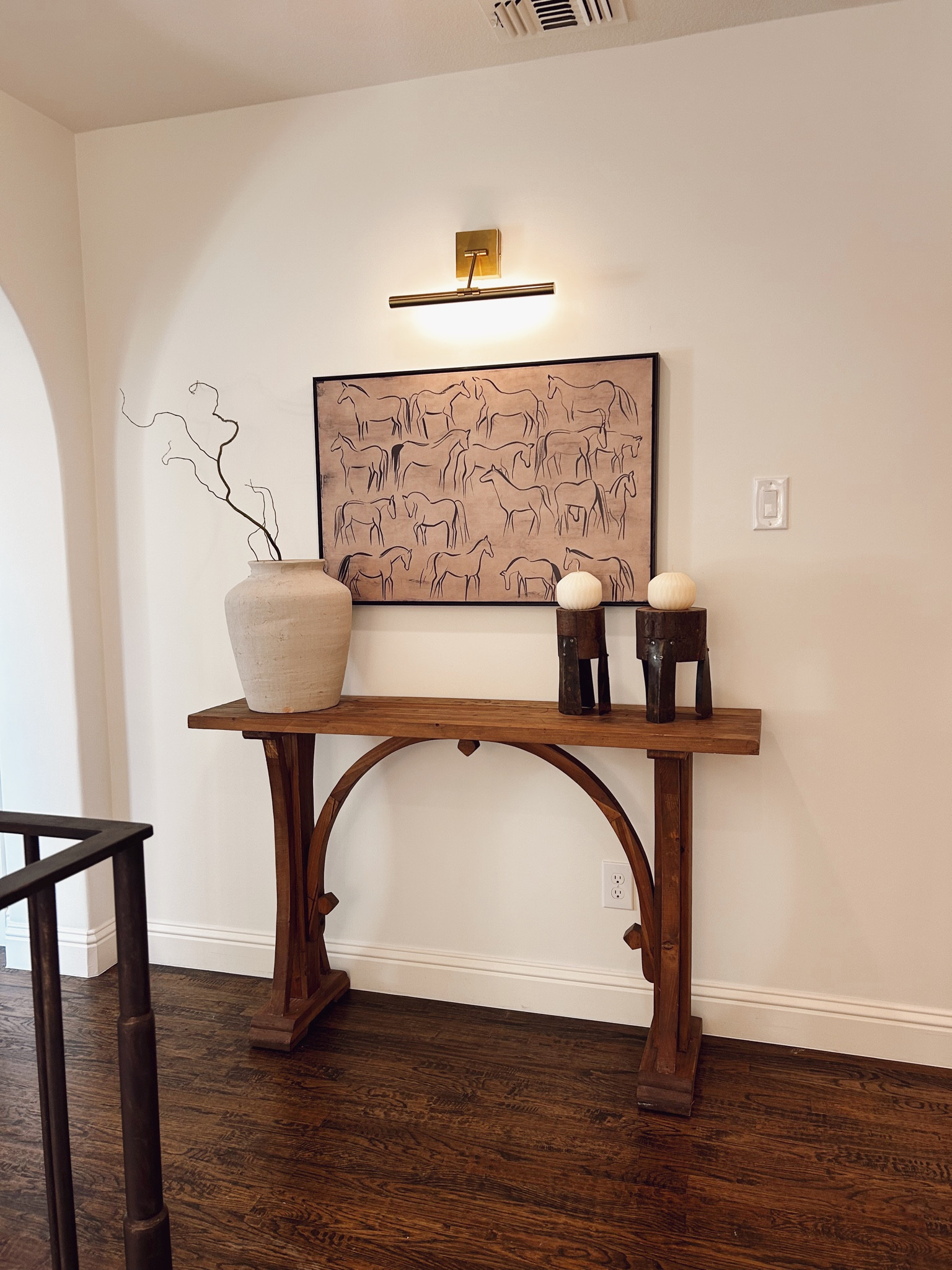 Simple styling that makes such a big impact. The warm wood tones, soft neutrals, and that statement artwork all come together to create a space that feels calm, elevated, and intentional.

A reminder that you don’t need a lot to make a space feel styled. Everything is linked if you want to recreate this look.

#LTKSeasonal #LTKHome