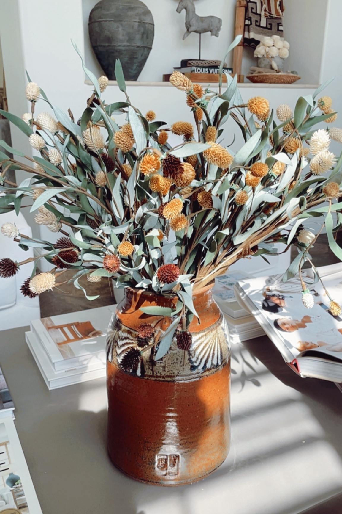 Loving these faux thistle branches on my coffee table this season! 

#falldecor #fallbranches #coffeetabledecor

#LTKHome #LTKStyleTip #LTKSeasonal