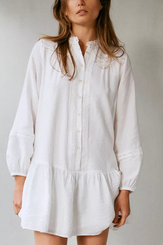Round neck dress with lace trim and long sleeves with elasticated cuffs. Matching front hemstitch... | Zara UK