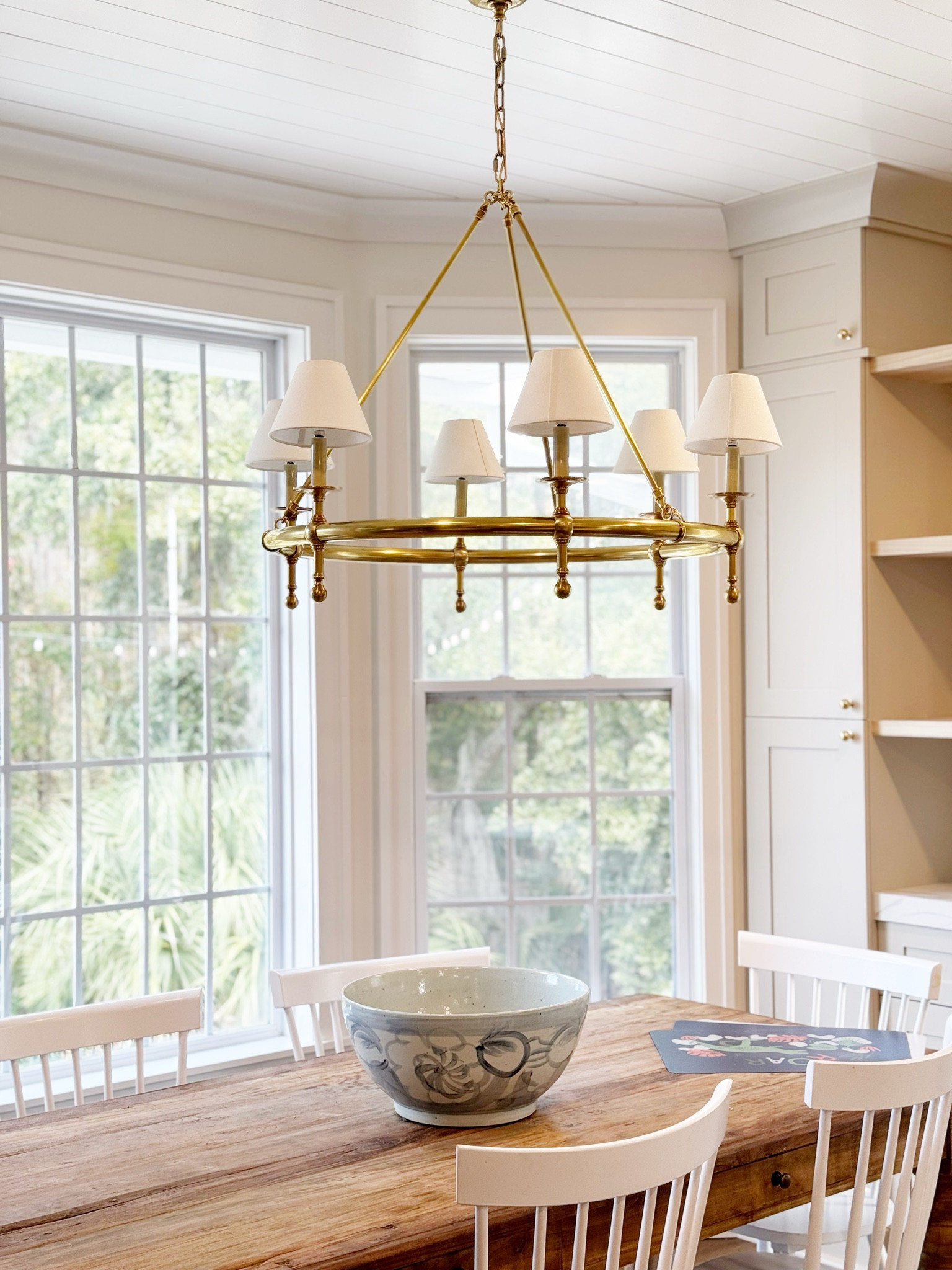 Brass chandelier in kitchen with linen shades 



#LTKhome #LTKstyletip