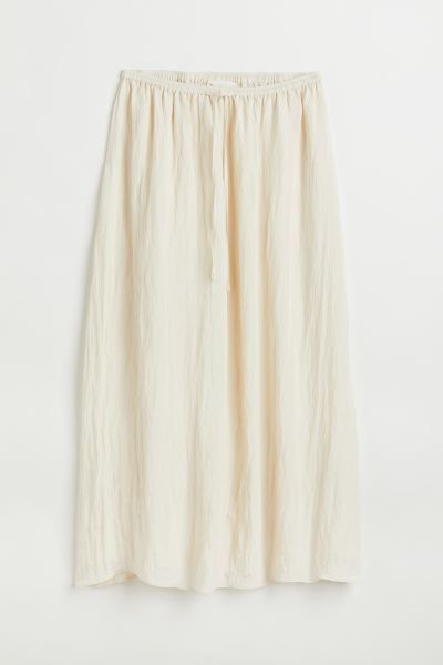 Relaxed-fit, calf-length skirt in woven fabric. High waist and waistband with drawstring and cove... | H&M (US + CA)