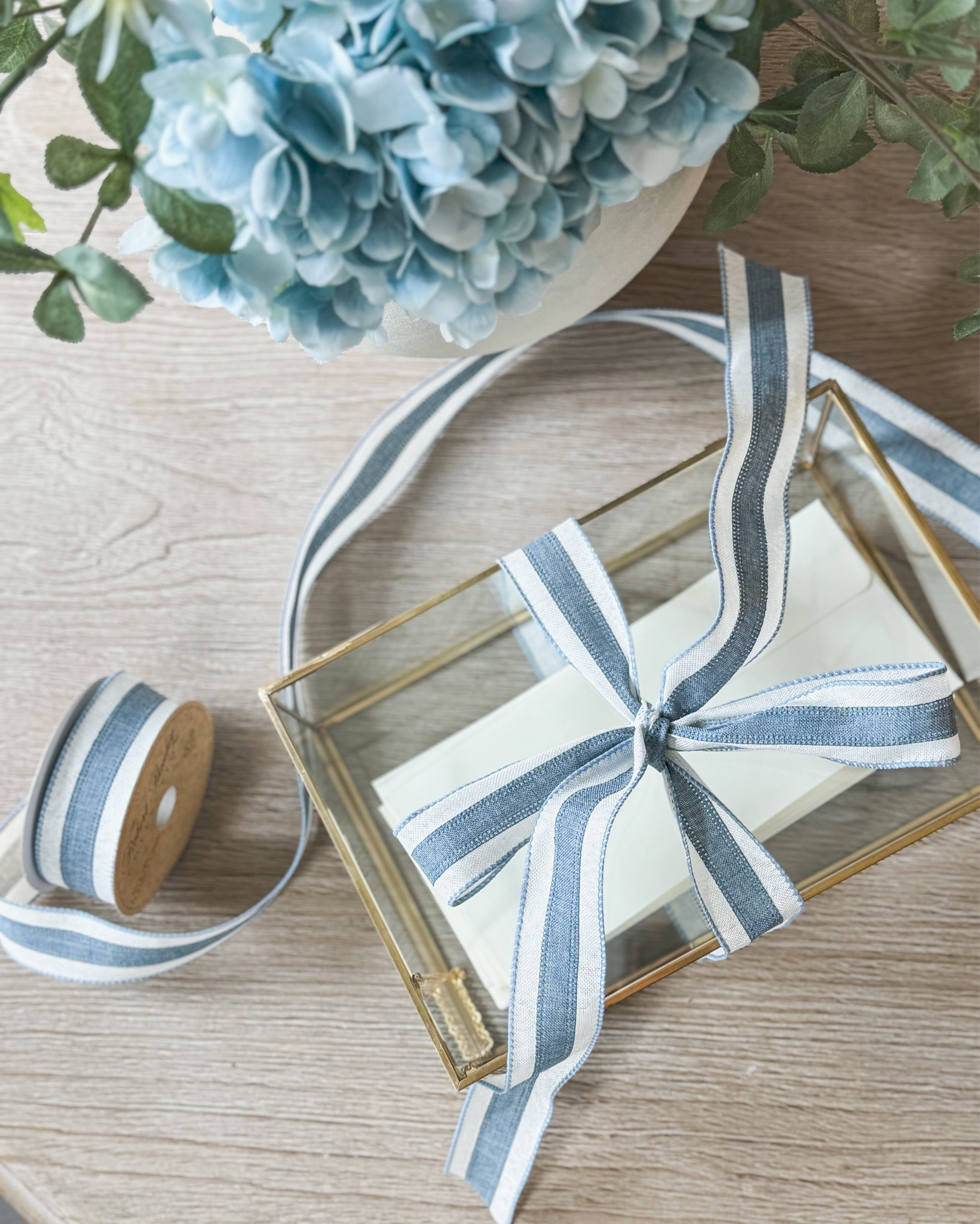 Looking for a special and meaningful gift for the bride and groom? Fill a pretty glass box with personalized letters to open throughout the year. Put them in cream or neutral envelopes with a little gift or trinket that goes along with the letter. Gift cards, photos, cash, & luggage tags are all ideas to go along with what your letter says. (Think about monogramming the luggage tags using the brides new monogram for hers — coordinate it to the first wedding day letter about embarking on an adventure.) What other small gifts could you come up with? Tie the glass box with a ribbon that coordinates with their wedding colors for a personal and thoughtful touch  

#wedding #weddinggift #letterstothebrideandgroom #glassbox

#LTKHome #LTKWedding