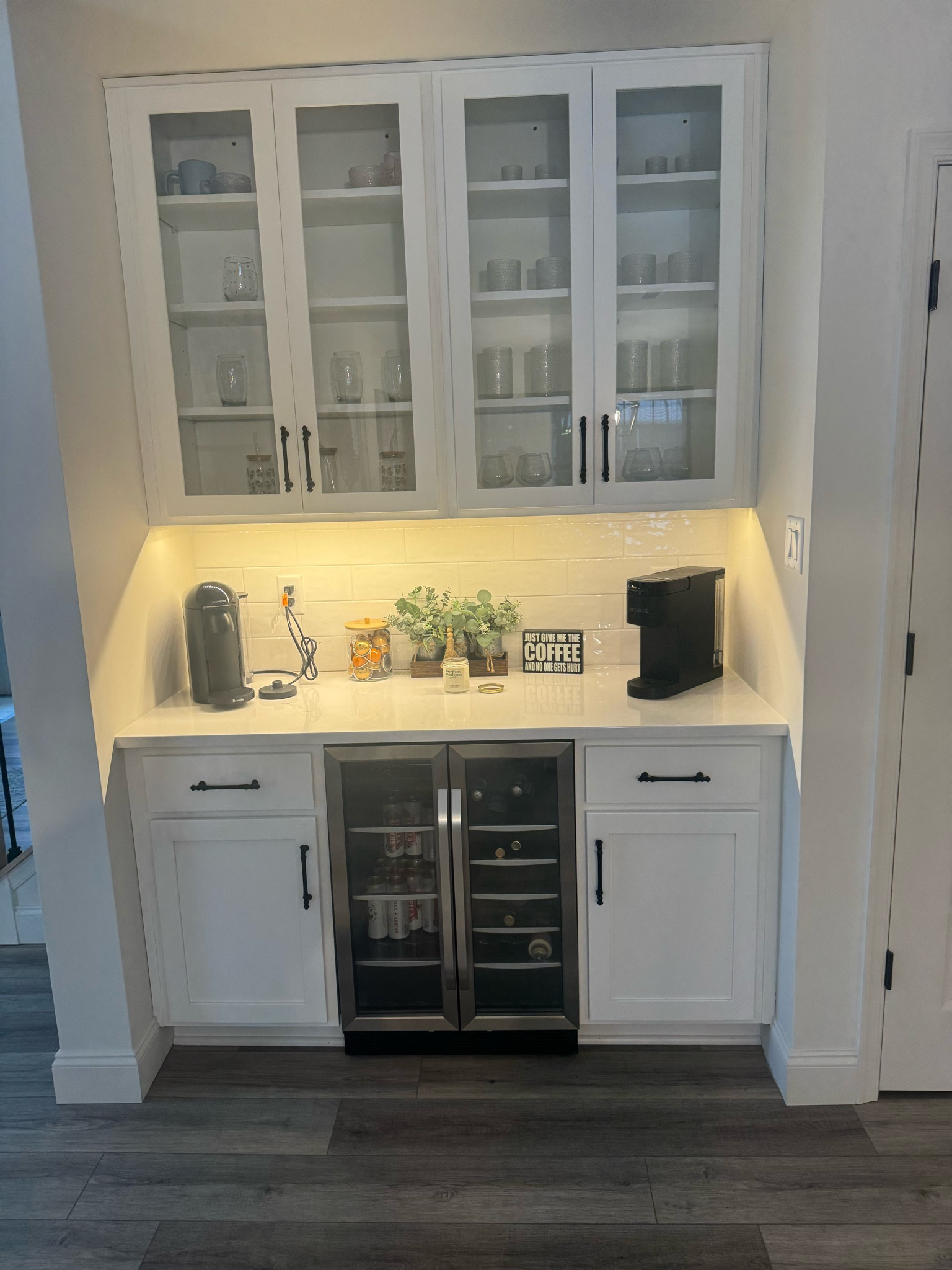 Loving up on this coffee/bar area of ours! The left side is all coffee & tea items! The mini fridge helps us on the coffee side & bar side together. One BIG issue? My hubby couldn’t live without his keurig 😏. What do you think in how I made the two come together? I love it! However I do think a REAL coffee machine on the left side would solve the issue of two machines. I also shared the idea on what machine I chose! 🫶🏼 

PS: these all make awesome gifts too! 
#amazonfinds #modernhome #farmhouse #modernfarmhomes #homes #coffeebar #homesweethome #inexspensivefinds 

#LTKGiftGuide #LTKHome #LTKStyleTip