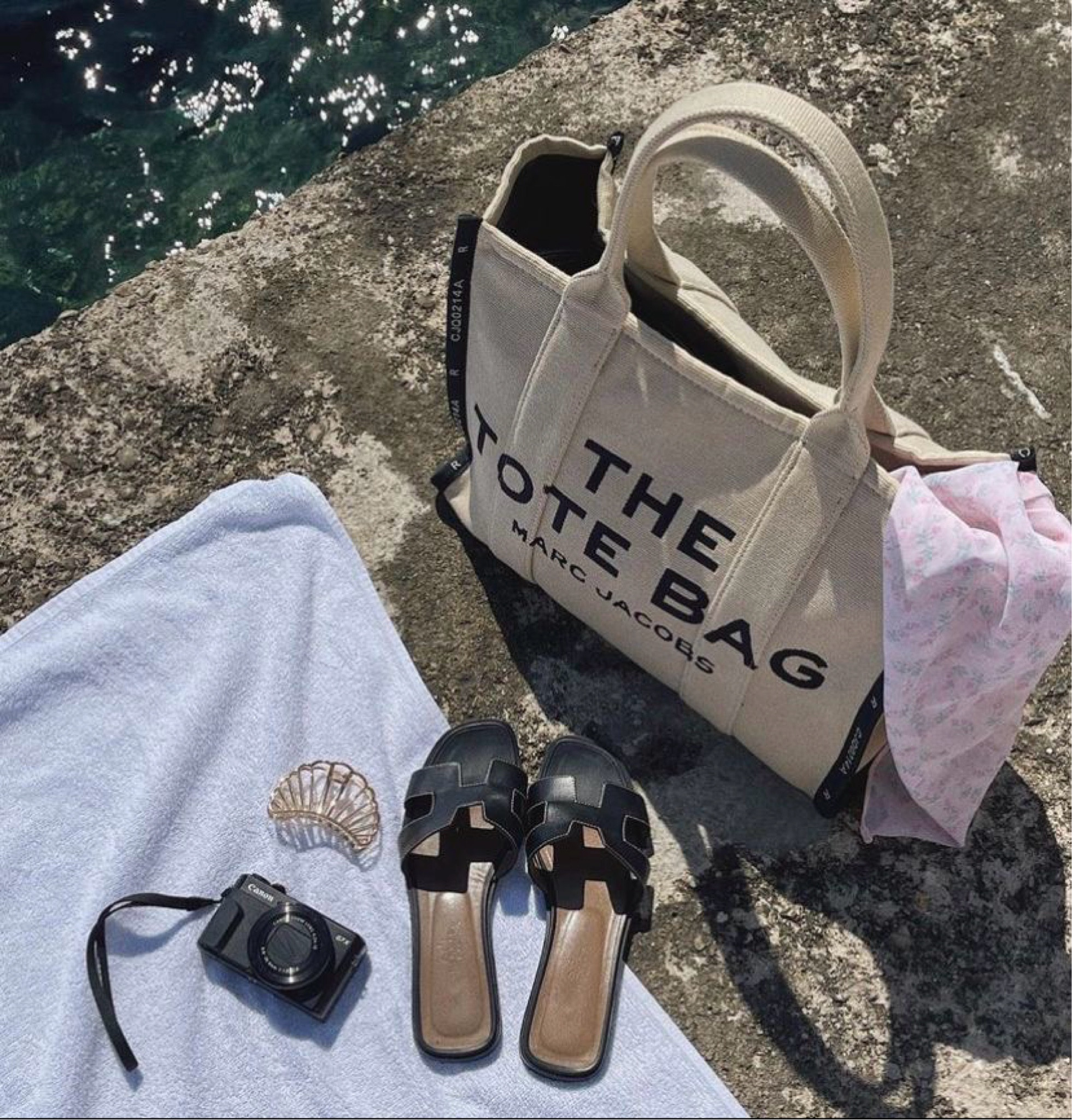 Dreaming of sun-soaked days by the sea with the perfect essentials! 🏖️✨ These chic Hermes slippers and the iconic Marc Jacobs tote bag are a must-have for your summer adventures. Effortlessly stylish and practical, they make the ultimate beach companions. Get yours now and elevate your summer wardrobe! #BeachReady #SummerStyle #MarcJacobs #Hermes #ChicEssentials #FashionMustHaves

#LTKItBag #LTKSwim #LTKShoeCrush