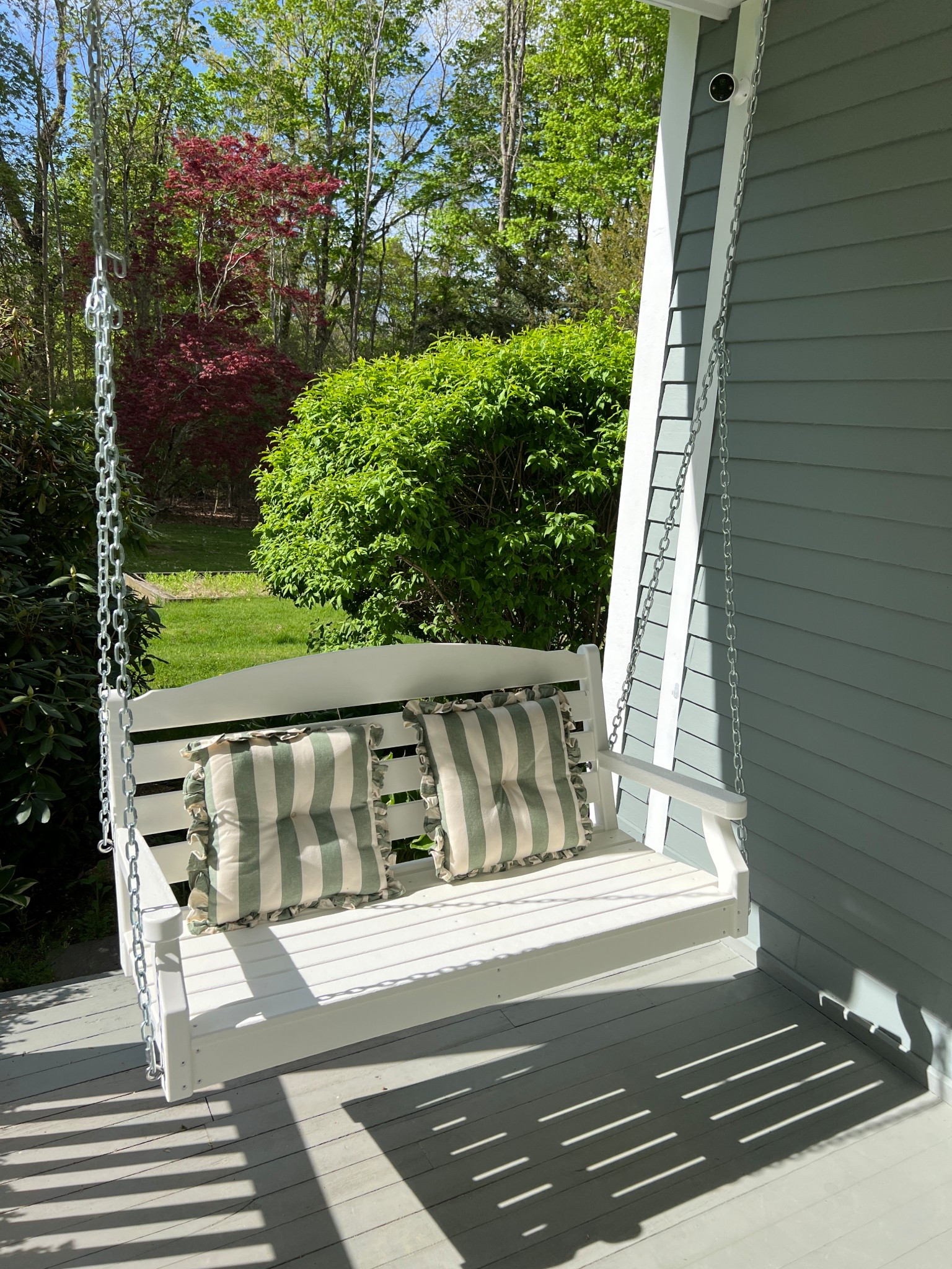 Striped pillows on a porch swing, super affordable! 

#LTKFindsUnder50 #LTKHome #LTKSeasonal