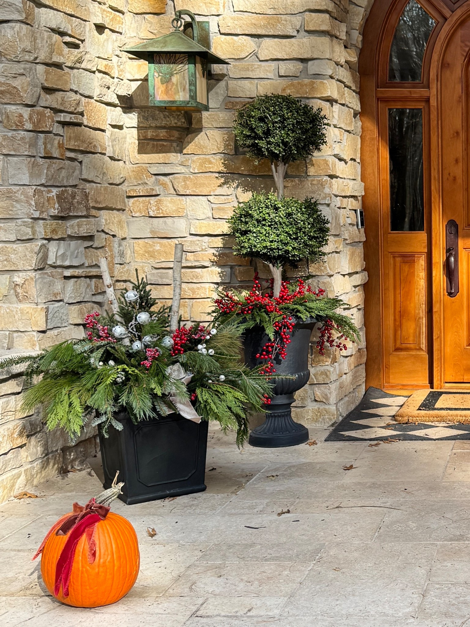 Transitioning the front porch from mums and pumpkins to holiday greens, garlands, and berries. 
The greens in the square pots are real. The Boxwood topiaries, greens and berries are faux  
kimbentley, front entry holiday decor

#LTKHome #LTKSeasonal #LTKSaleAlert