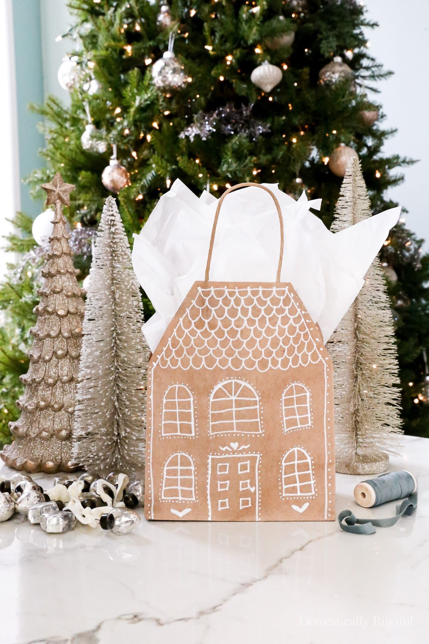 This DIY Gingerbread House Gift Bag is a fun and festive way to decorate a basic brown gift bag into something special for Christmas.

See details:
https://domesticallyblissful.com/diy-gingerbread-house-gift-bag/

🔗 Join our newsletter:
https://domesticallyblissful.com/newsletter/ 

#LTKGiftGuide #LTKSeasonal #LTKHoliday