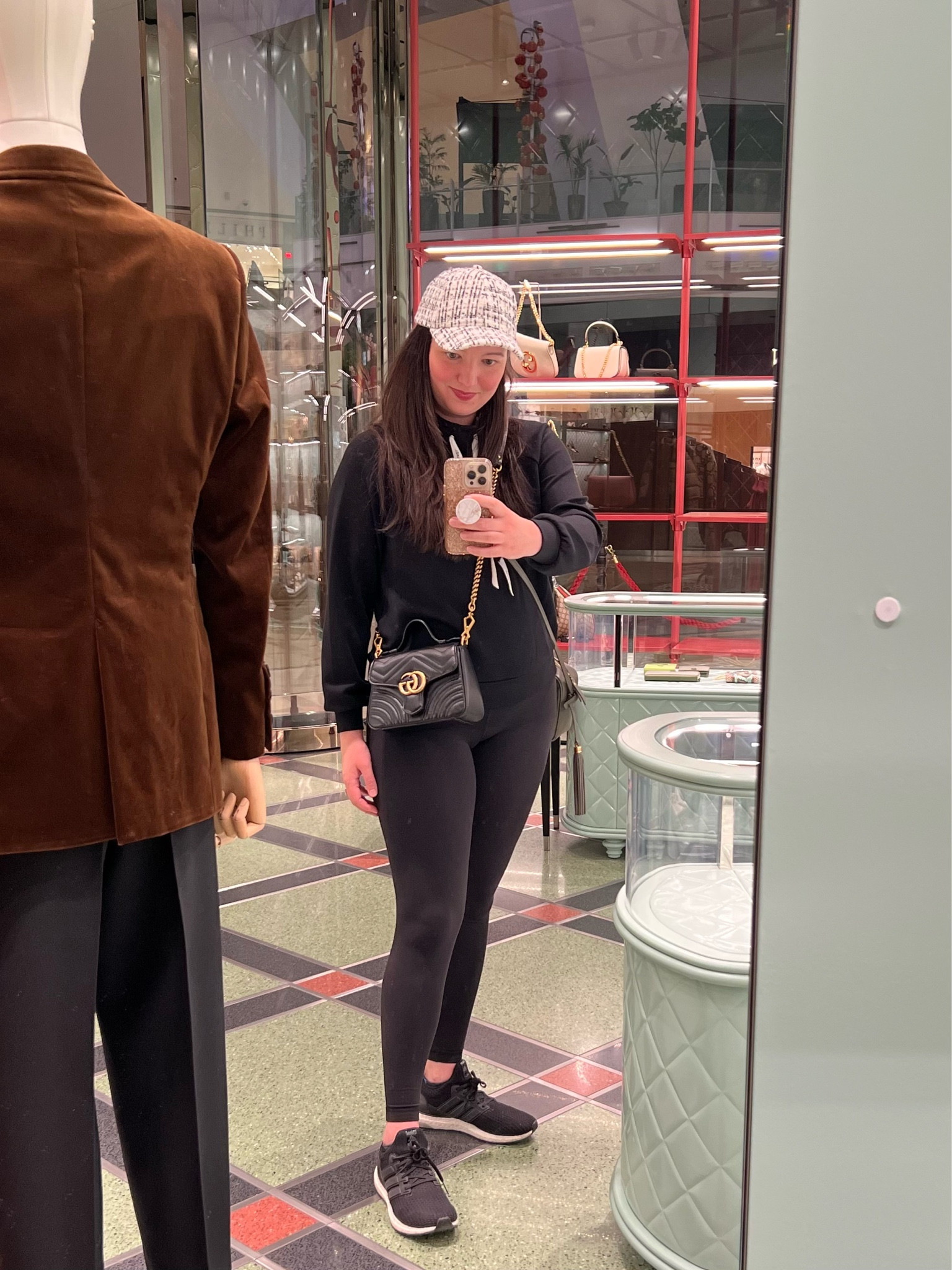 Trying on the Gucci GG Marmont Mini Top Handle Bag.  I wish it were just slightly larger and that the strap were adjustable or longer - I’m 5’7”.  Strap is removable so I could use I different one - love the look so I’m torn!