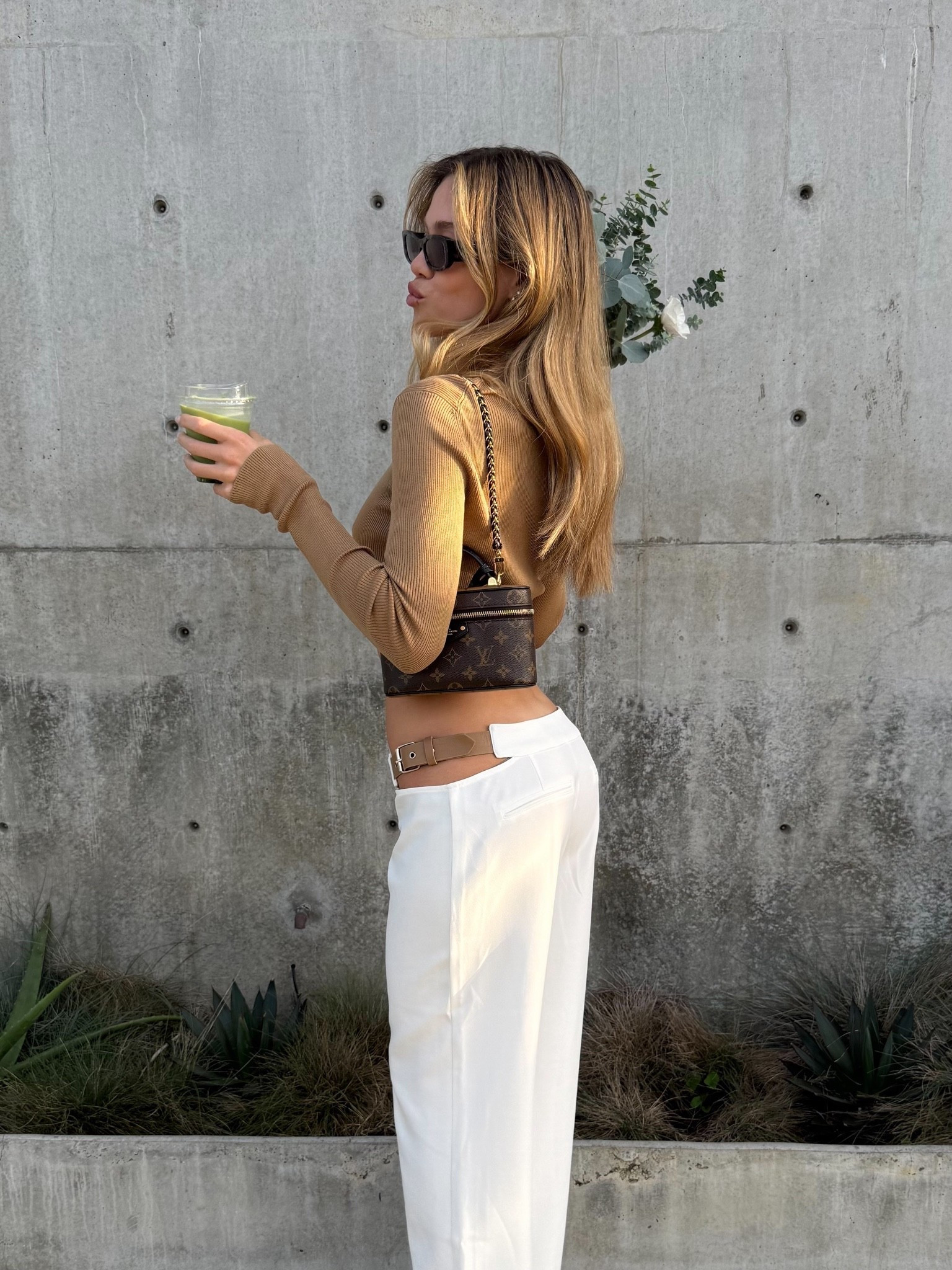 The cutest unique little trousers, I wear a size small and they run long - I wear them with heels. The top is from Prada and the bag is called the vanity chain pouch by lv- I tagged a similar style that I could find xx