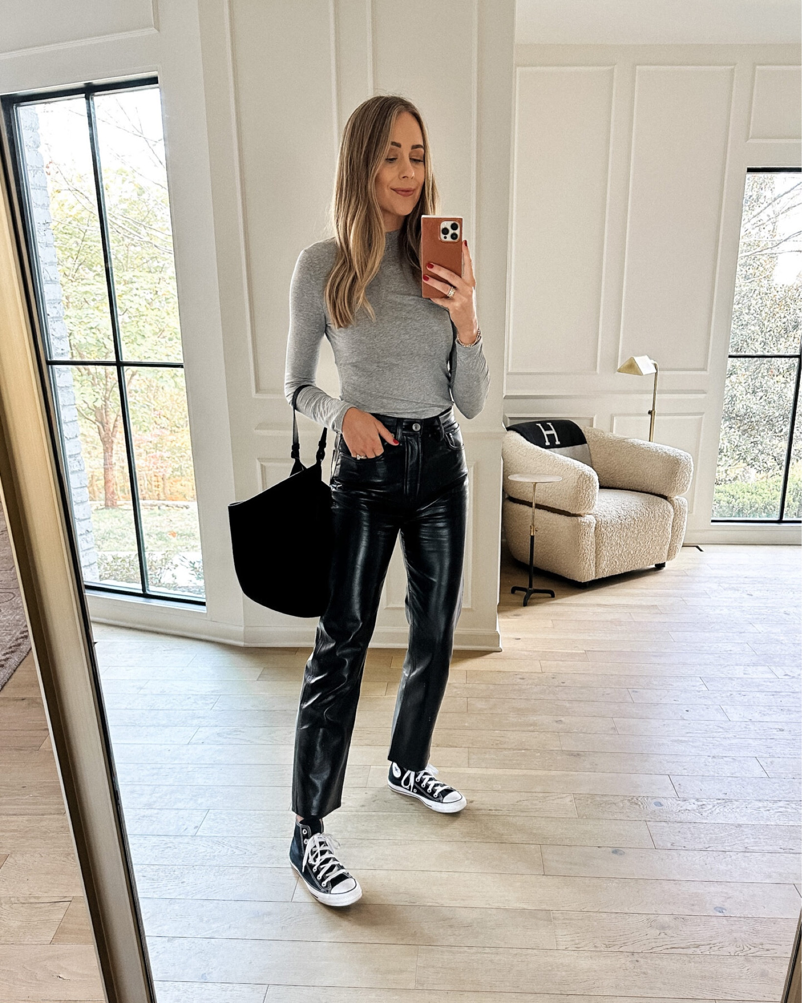 Fashion Jackson wearing AGOLDE leather Pants, converse sneakers, khaite handbag #fashionjackson #converse  

#LTKunder100 #LTKstyletip #LTKshoecrush