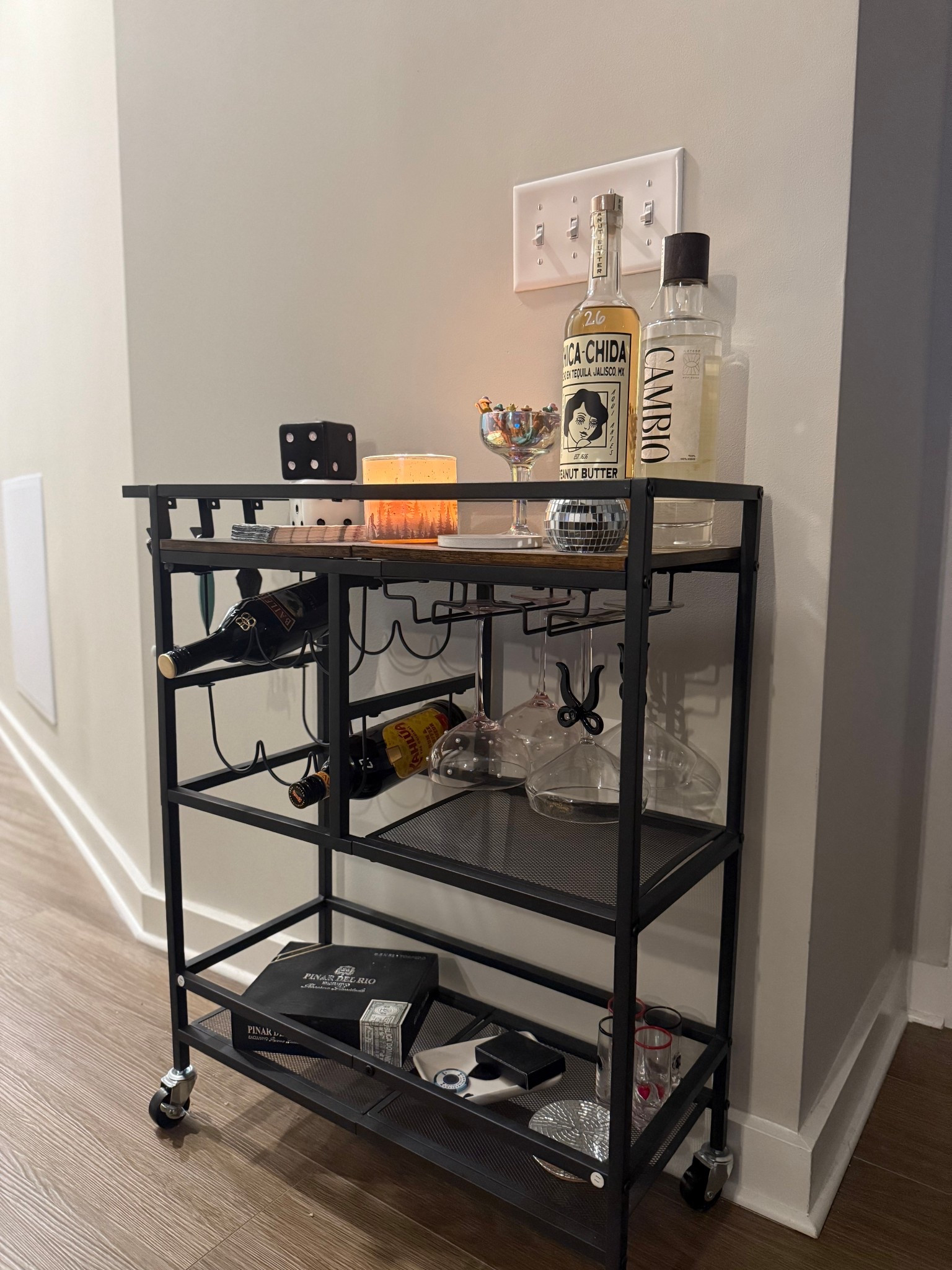 Bar cart #barcart #apartmentfinds 
Tagged what I could! Both martini glasses, napkins and shot glasses are TJ MAXX, cigar box and ace of spade tray are thrifted. 

#LTKHome