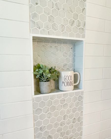 The mosaic carrera marble look porcelain tile accent strip
Is my favorite feature in my shower. It is also on the shower floor. The larger format subway tile is in all the other walls. 

#LTKFind #LTKstyletip #LTKhome