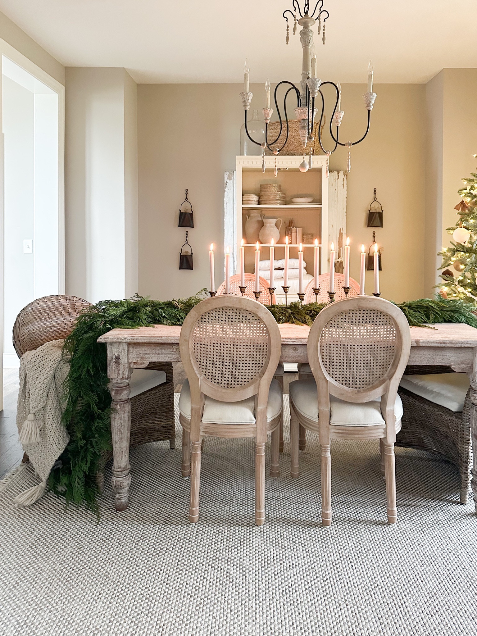 Holiday dining decor / Christmas tablescape/ target style / studio McGee / hearth and hand / French country / garland / cane dining chairs / centerpiece / candle sticks / Christmas tree 

#LTKCyberWeek #LTKHoliday #LTKSeasonal