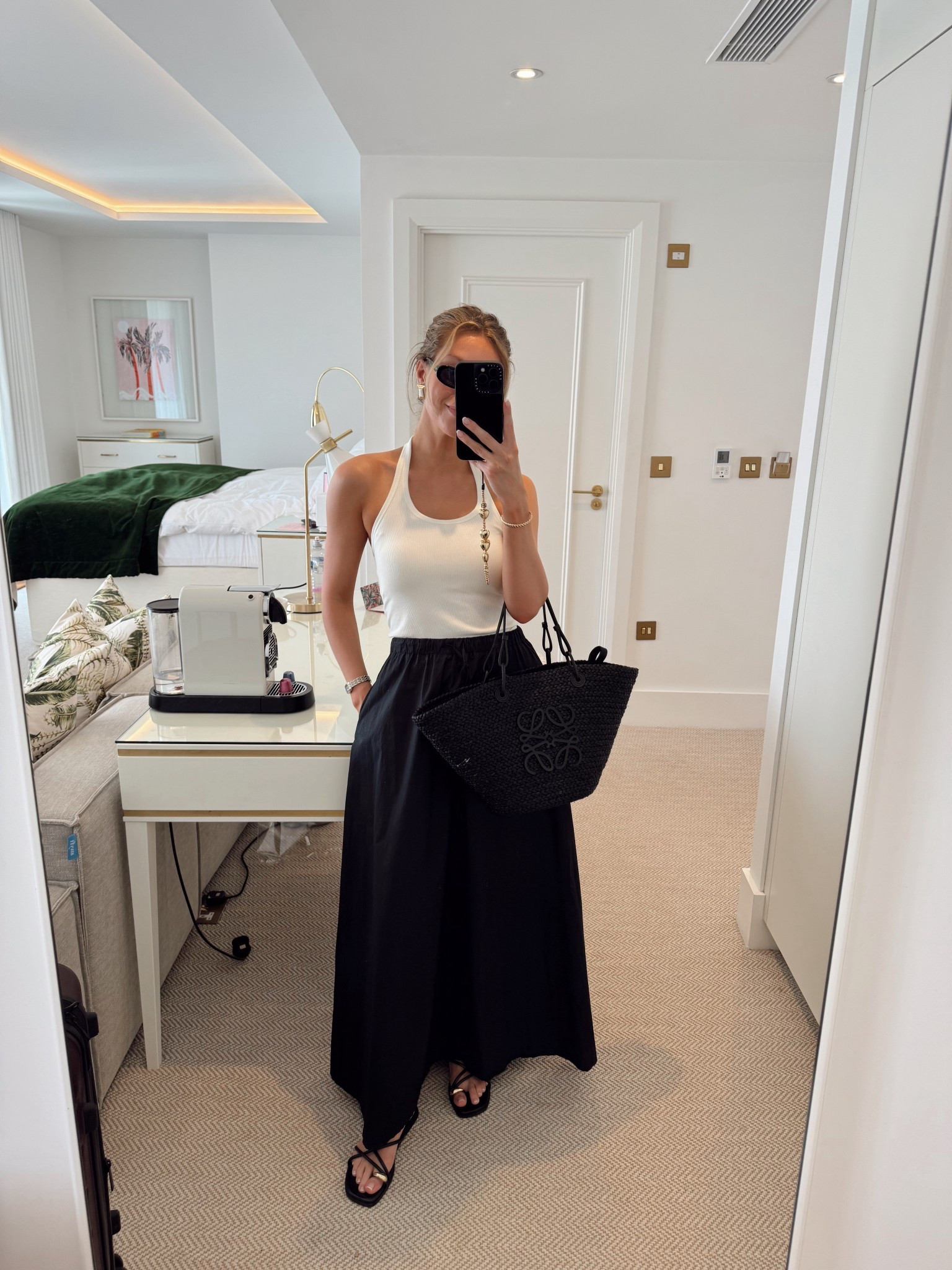 Poplin black maxi skirt from H&M, halter neck bra top from Uniqlo, black basket bag, black sandals 

#LTKsummer #LTKspring #LTKAroundTheWorld