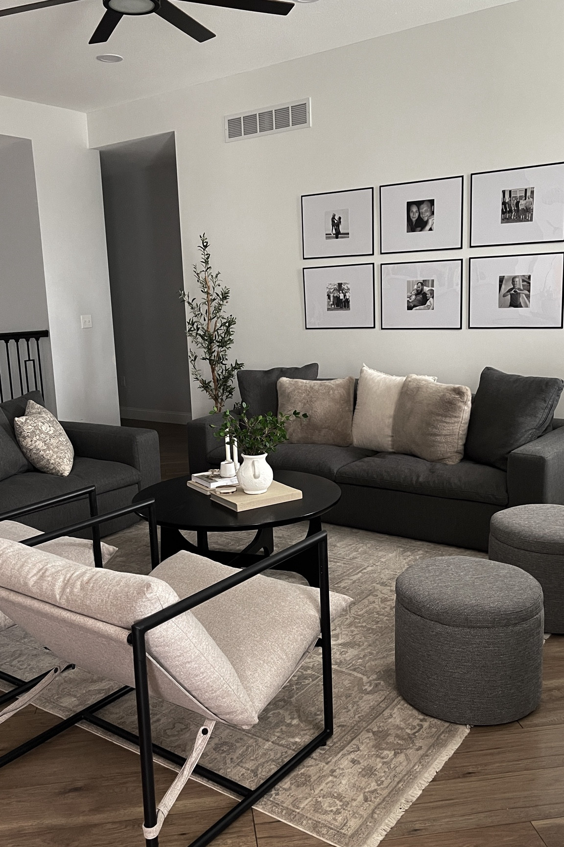 Livingroom with dark gray couches. Modern and cozy. Ottoman poufs, beige accent chairs, affordable livingroom decor, photo gallery wall

#LTKhome #LTKstyletip #LTKfindsunder100