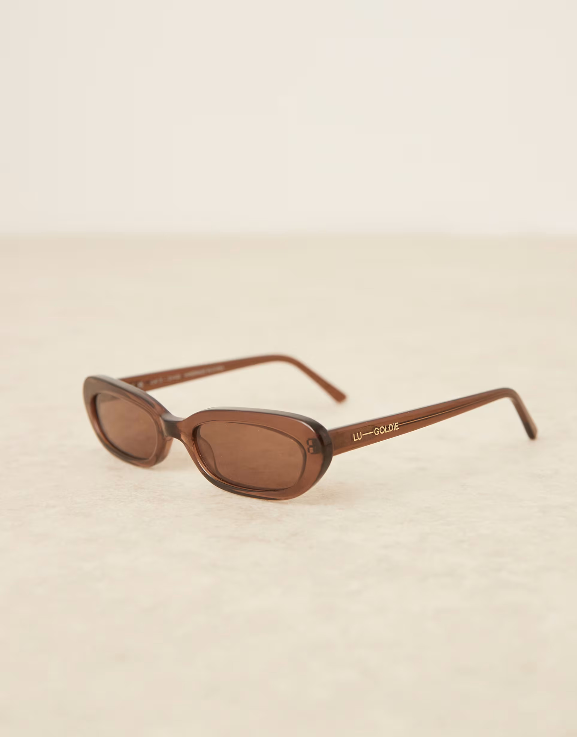 Lu Goldie Lola slim oval sunglasses in coffee | ASOS (Global)