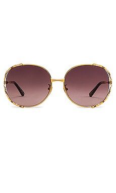 Gucci Round in Shiny Yellow Gold & Brown from Revolve.com | Revolve Clothing (Global)