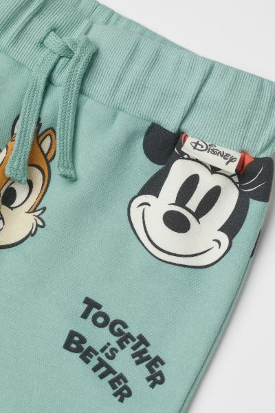 Disney x H&M. Cozy sweatpant joggers with a printed pattern and soft, brushed inside. Wide, elast... | H&M (US + CA)