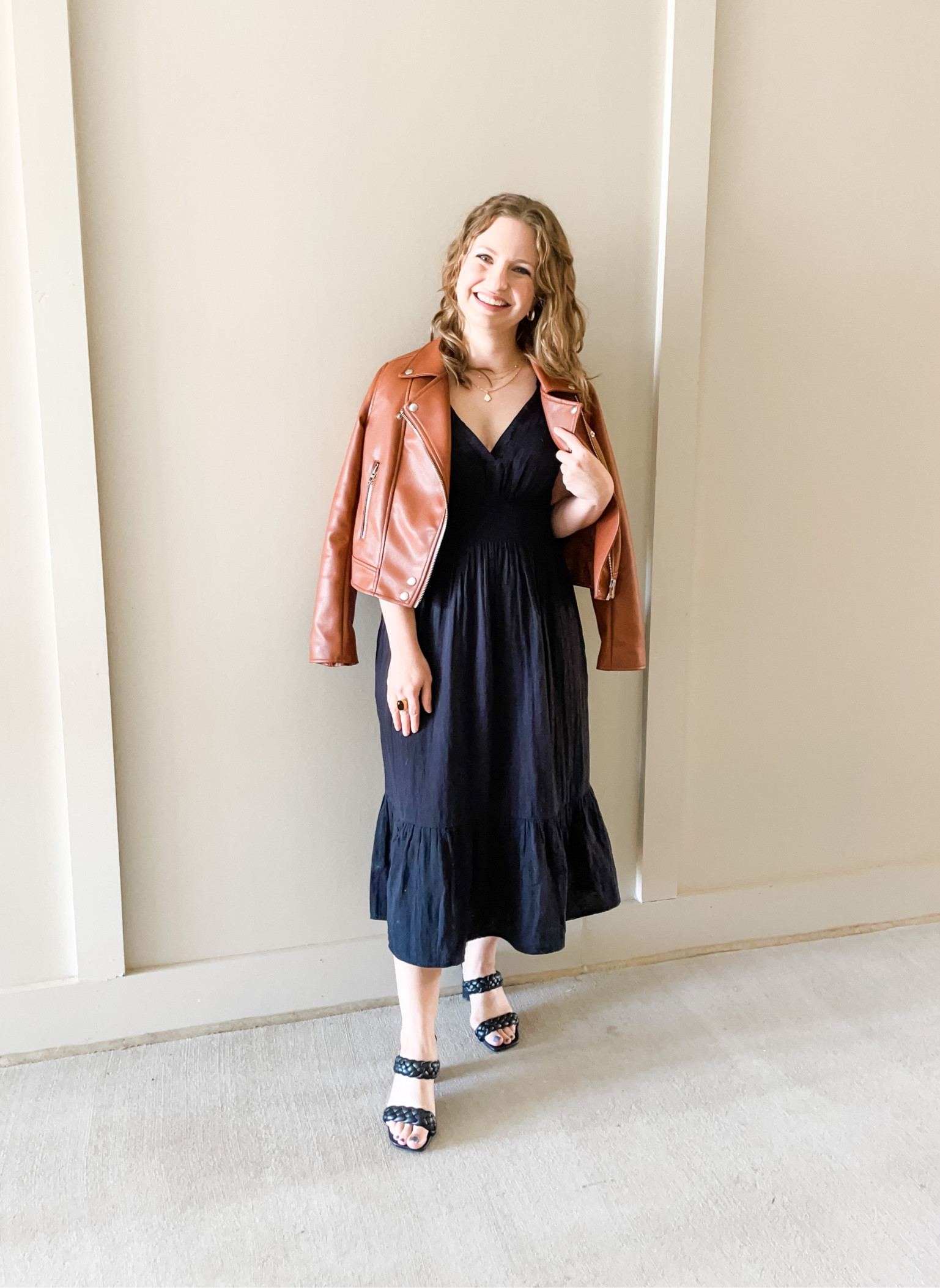 Black v neck smocked waist midi dress // Brown faux leather jacket// Black braided double strap heels

#LTKstyletip #LTKSeasonal #LTKunder50