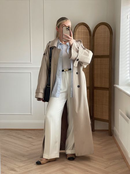 Trench coat, striped shirt, white t-shirt, black leather belt, white wid leg trousers, two tone ballet flats, leather crossbody bag

#LTKeurope #LTKSeasonal #LTKstyletip