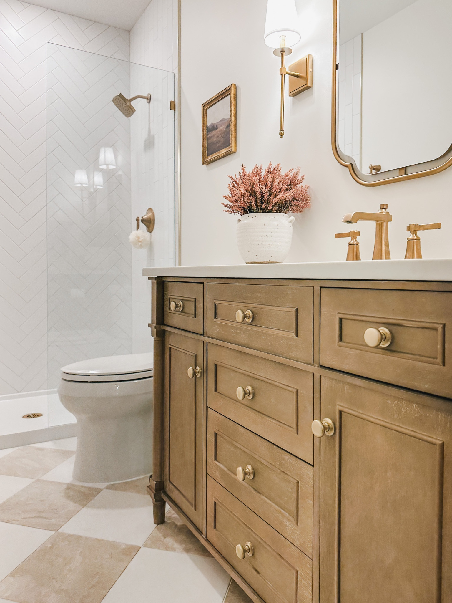 A closer look at my guest vanity! I switched the original hardware for these gold knobs that tie in great with my other fixtures 

Home design, guest bathroom, bathroom refresh, style inspo, light and bright, pops of pink for the fall, creamy whites, warm wood tones, neutral home, gold detail, home refresh, bathroom info, guest bath finds, Wayfair, Michaels, Amazon, Target, Home Depot, At Home, aesthetic home, faux florals, vanity finds, gold fixture, shower glass panel, pink robe, home decor, bath detail, shop the look!

#LTKstyletip #LTKSeasonal #LTKhome