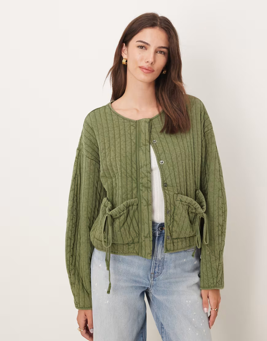 ASOS DESIGN quilted jacket with bow pocket detail in washed khaki green | ASOS (Global)